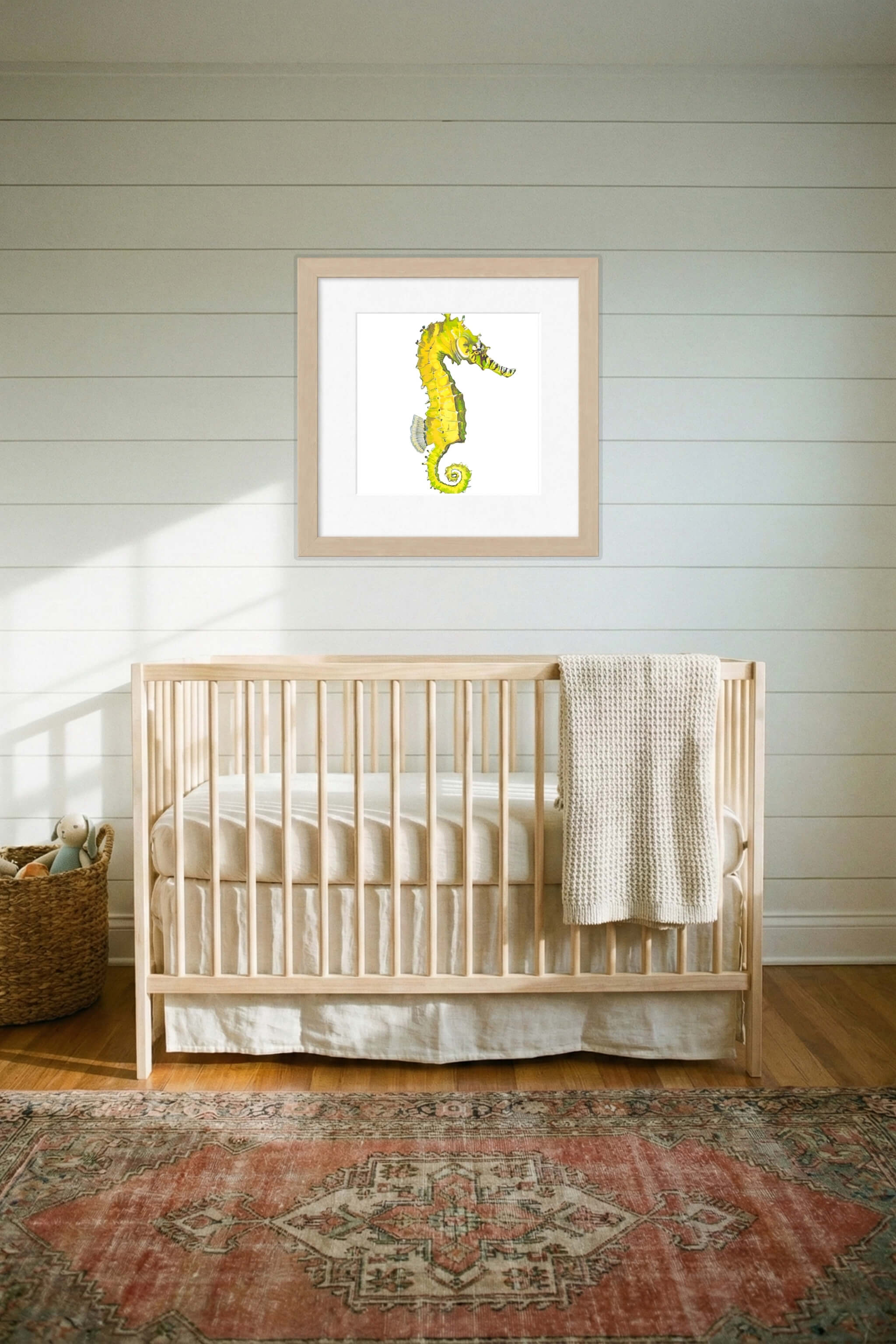 giclee print of watercolor painting of yellow seahorse by emily bourassa in above crib