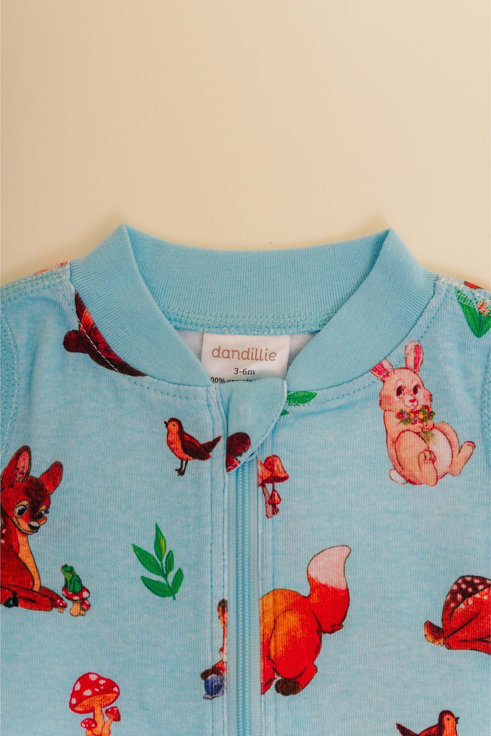 organic cotton baby zipper sleeper with fold-over cuffs in blue animal print designed by anna iwin