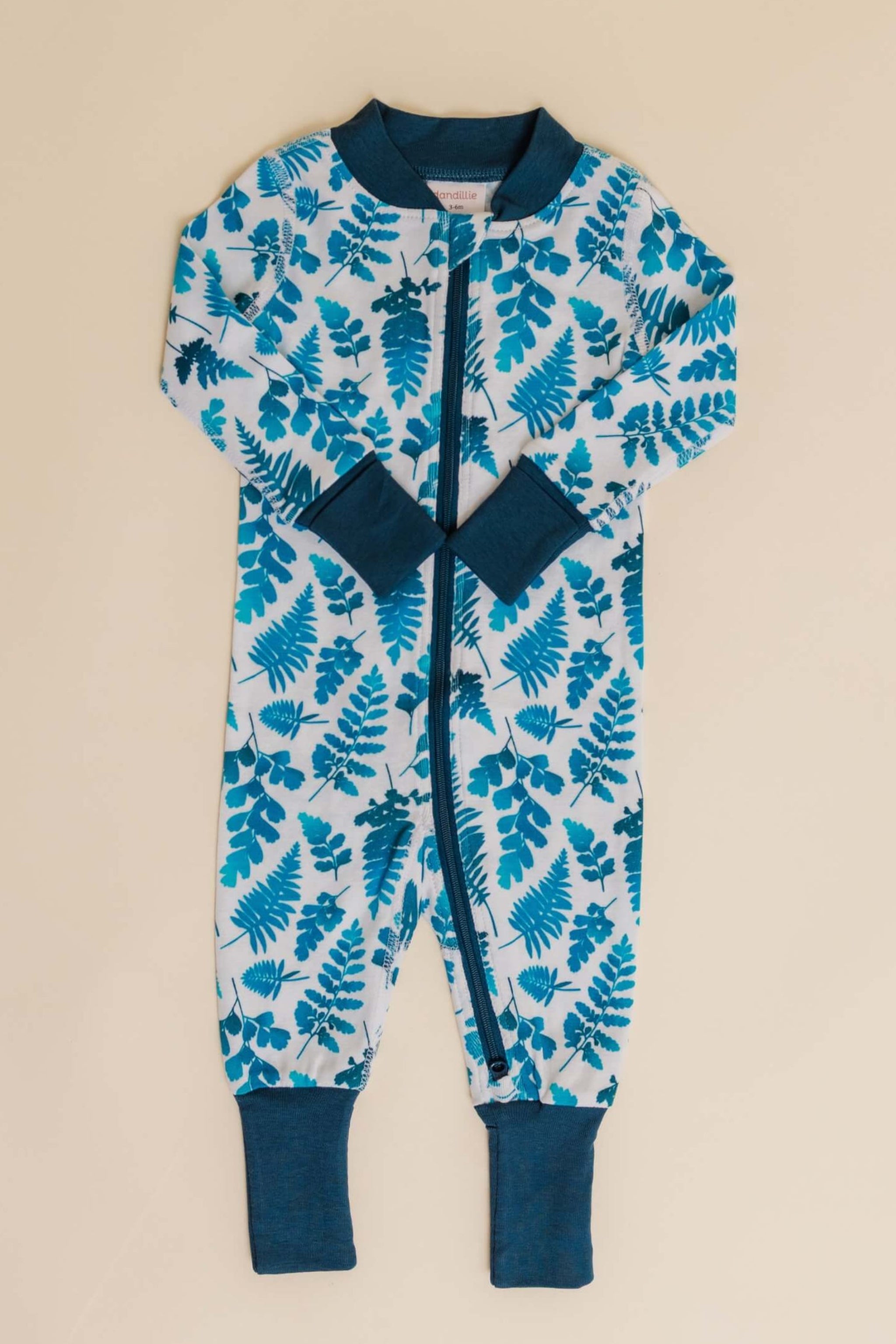 organic cotton baby zipper sleeper with fold-over cuffs in blue fern print designed by jen johnston