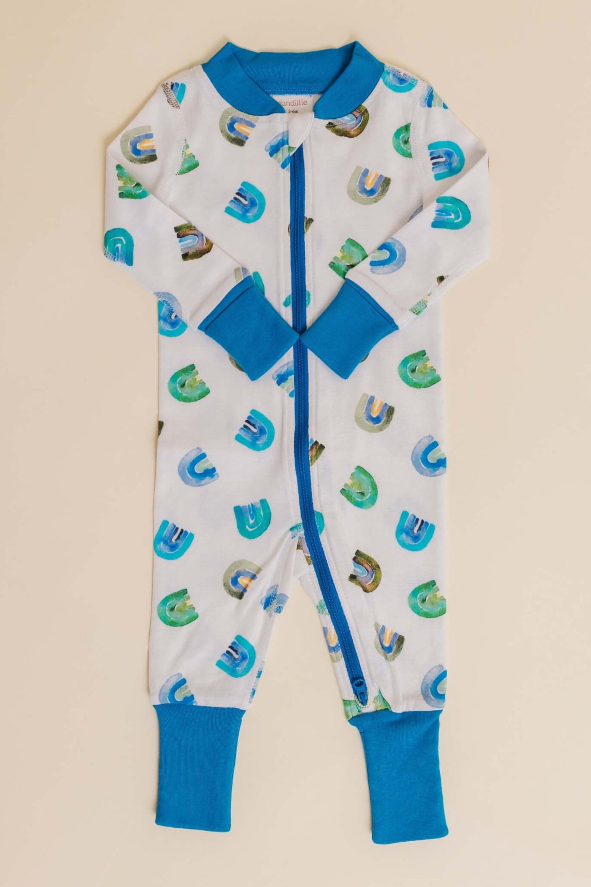 organic cotton baby zipper sleeper with fold-over cuffs in blue rainbow print designed by madeline kerrii