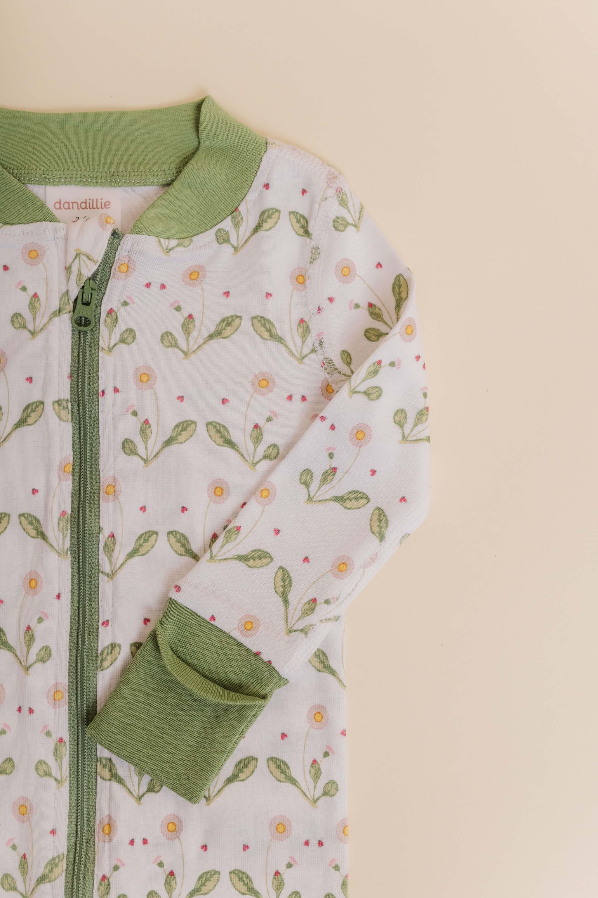 organic cotton baby zipper sleeper with fold-over cuffs in green daisy print designed by giacomina ferrillo