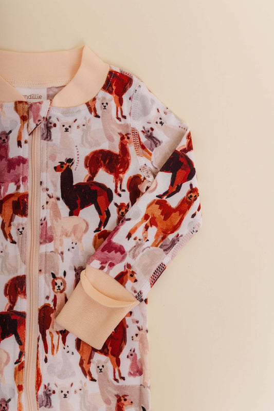 organic cotton baby zipper sleeper with fold-over cuffs in tan alpaca print designed by barbra ignatiev