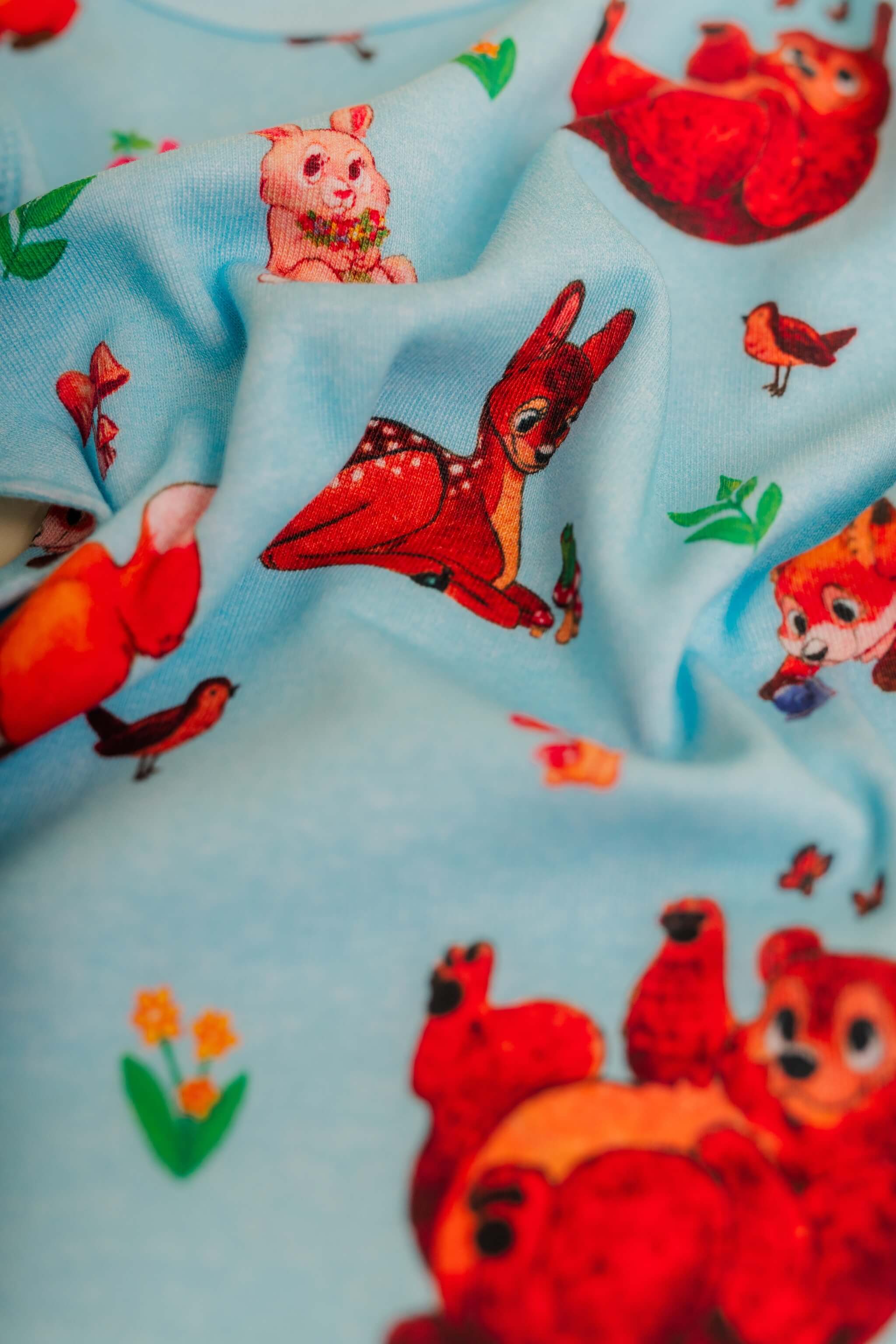 organic cotton children's long sleeve sleepwear in blue animal print designed by anna iwin