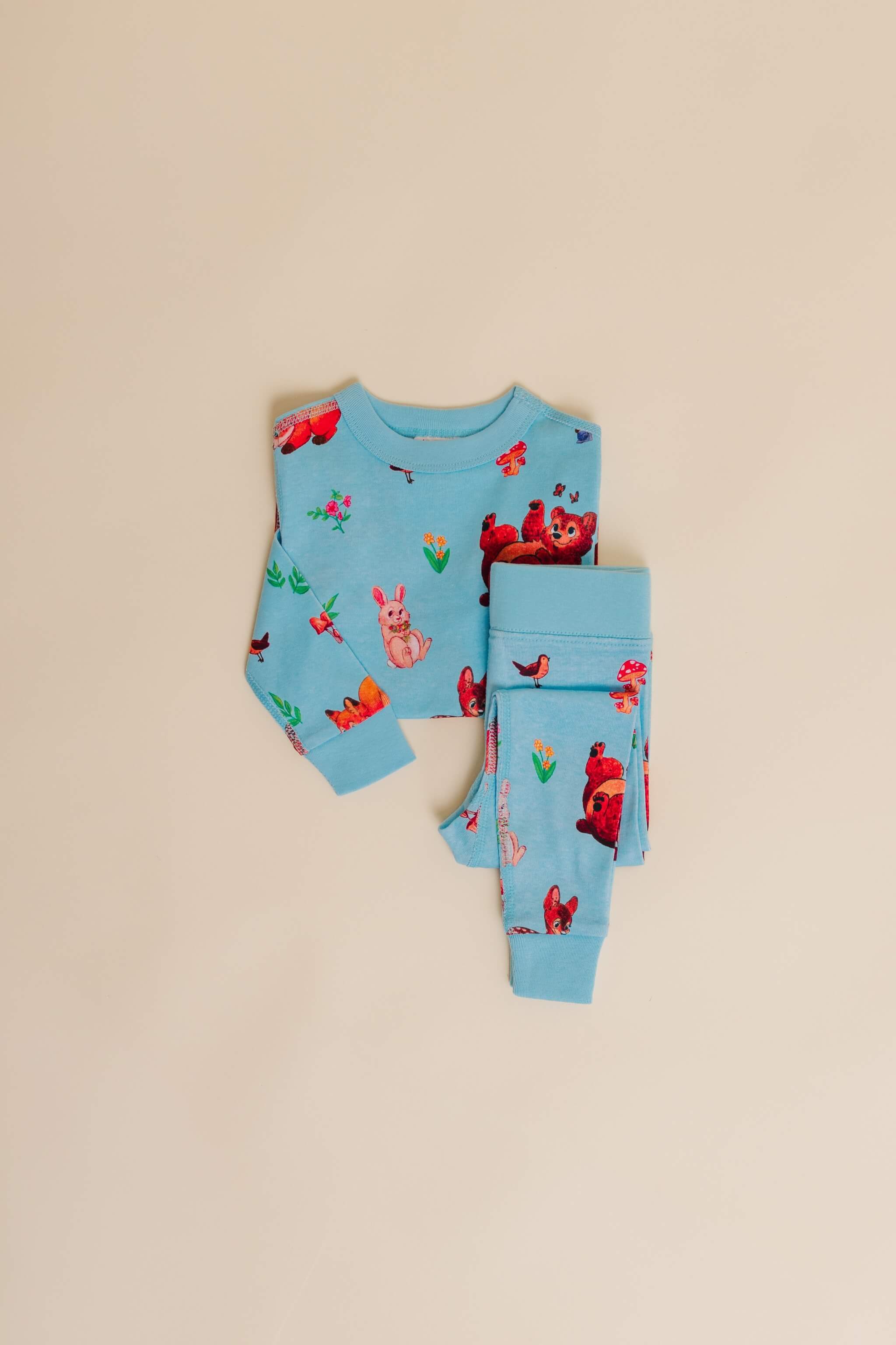 organic cotton children's long sleeve sleepwear in blue animal print designed by anna iwin