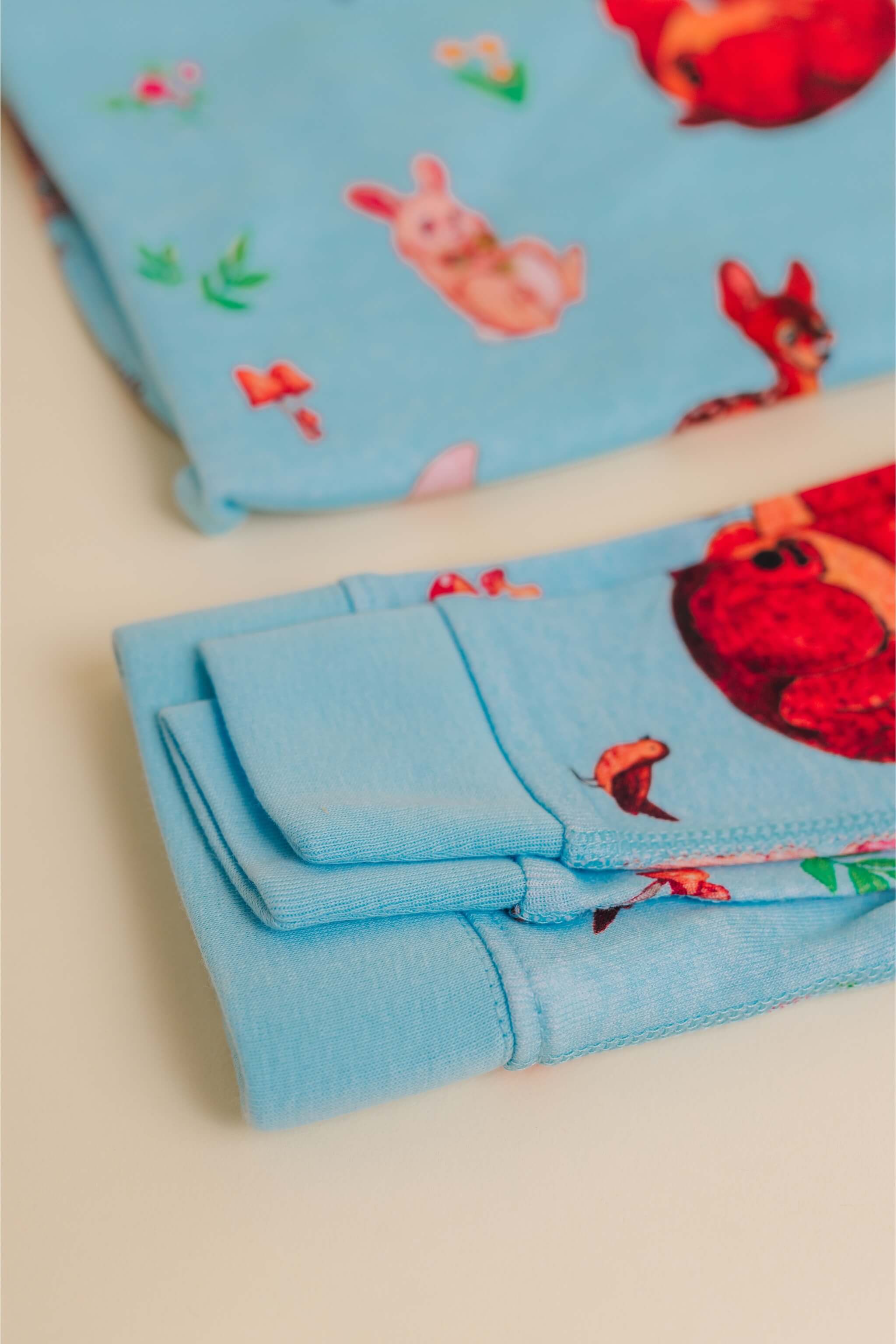 organic cotton children's long sleeve sleepwear in blue animal print designed by anna iwin