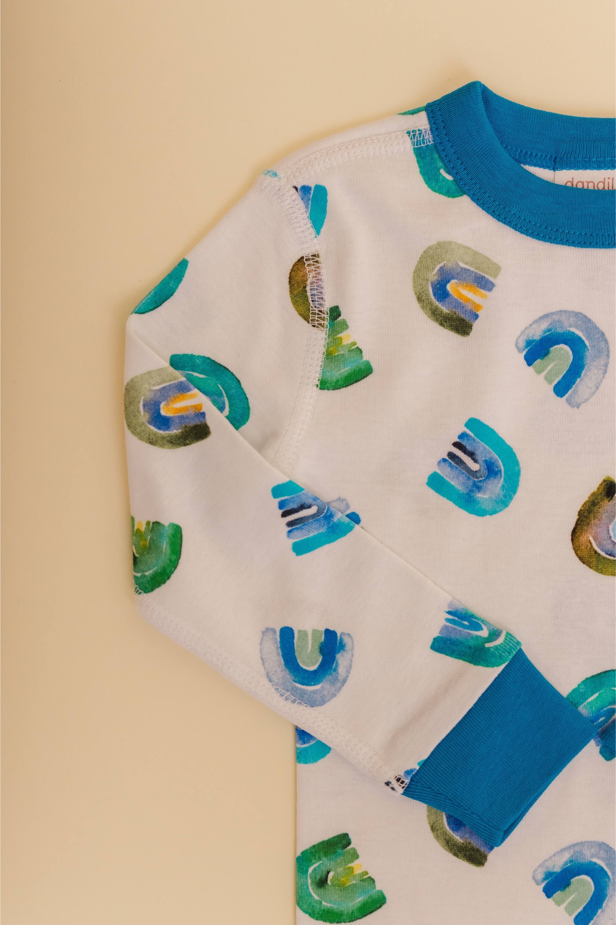 organic cotton children's long sleeve sleepwear in blue rainbow print designed by madeline kerrii