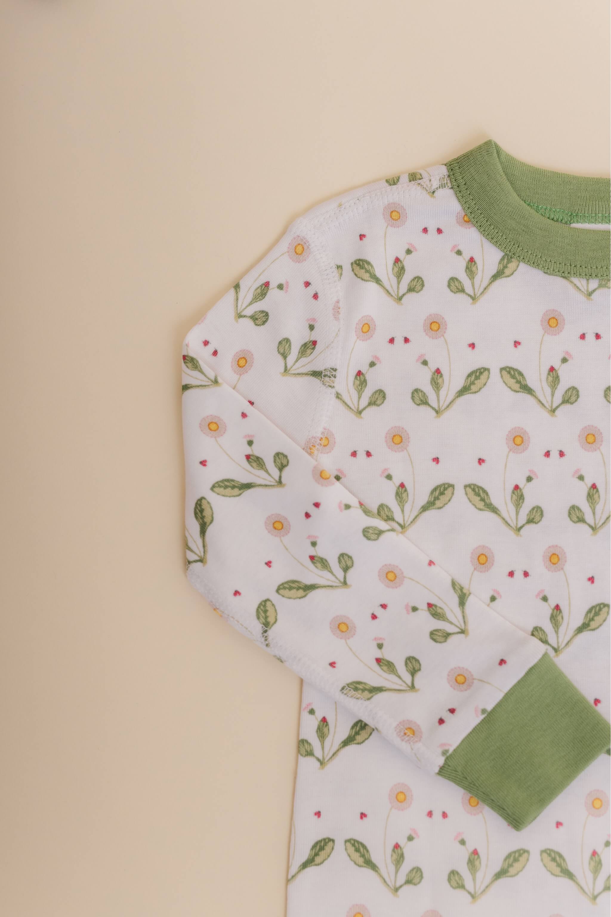 organic cotton children's long sleeve sleepwear in green daisy print designed by giacomina ferillo