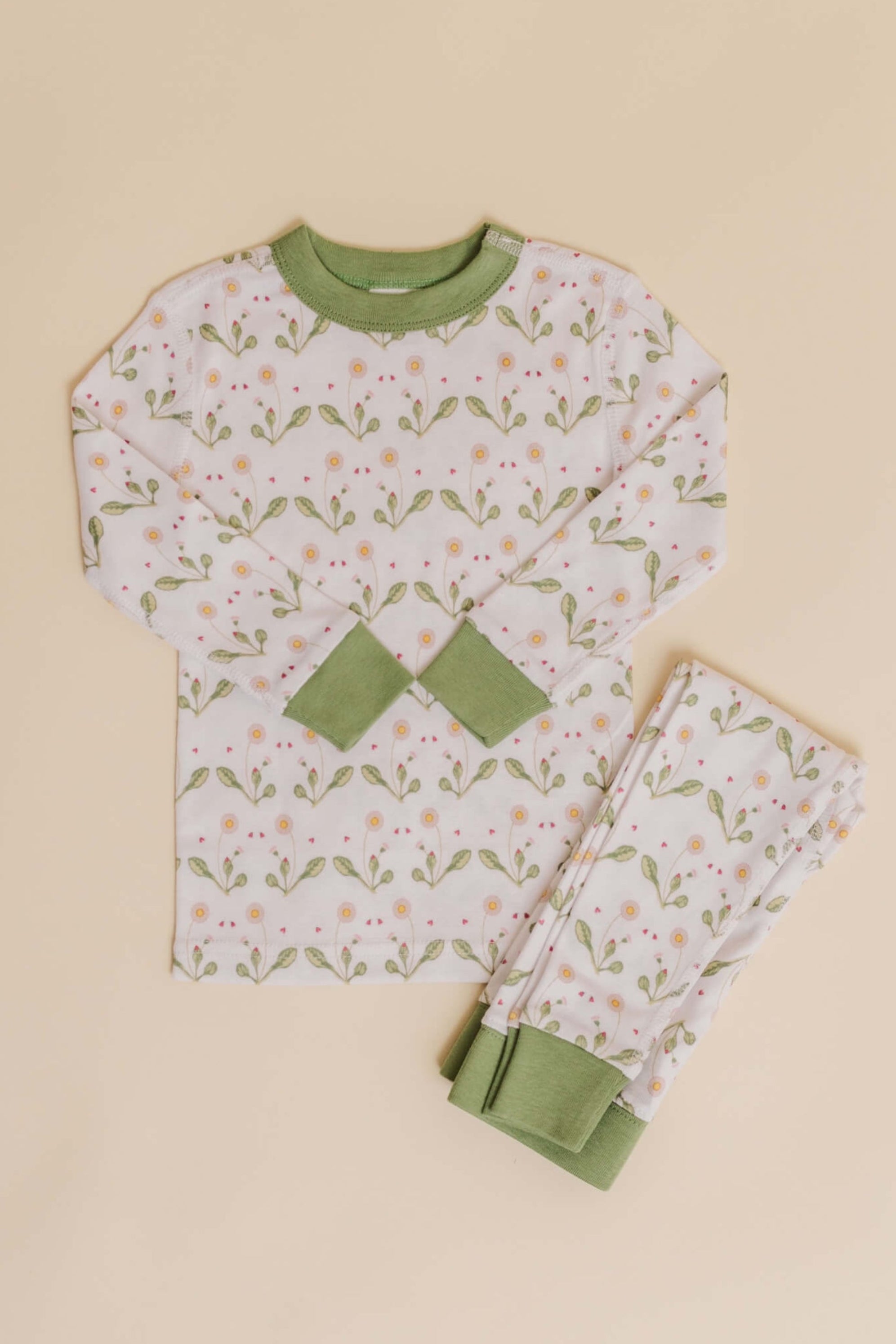 organic cotton children's long sleeve sleepwear in green daisy print designed by giacomina ferillo