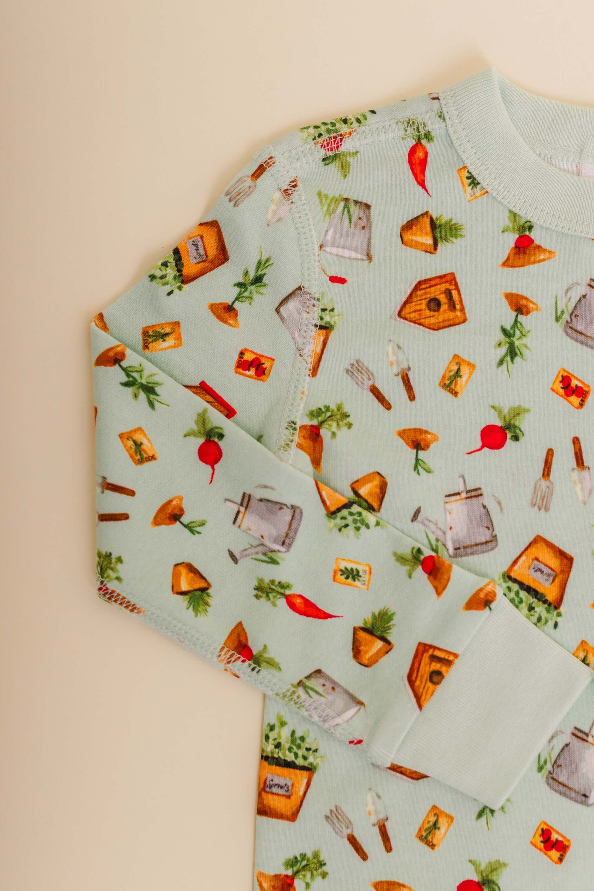 organic cotton children's long sleeve sleepwear in green garden print designed by cris rogerson