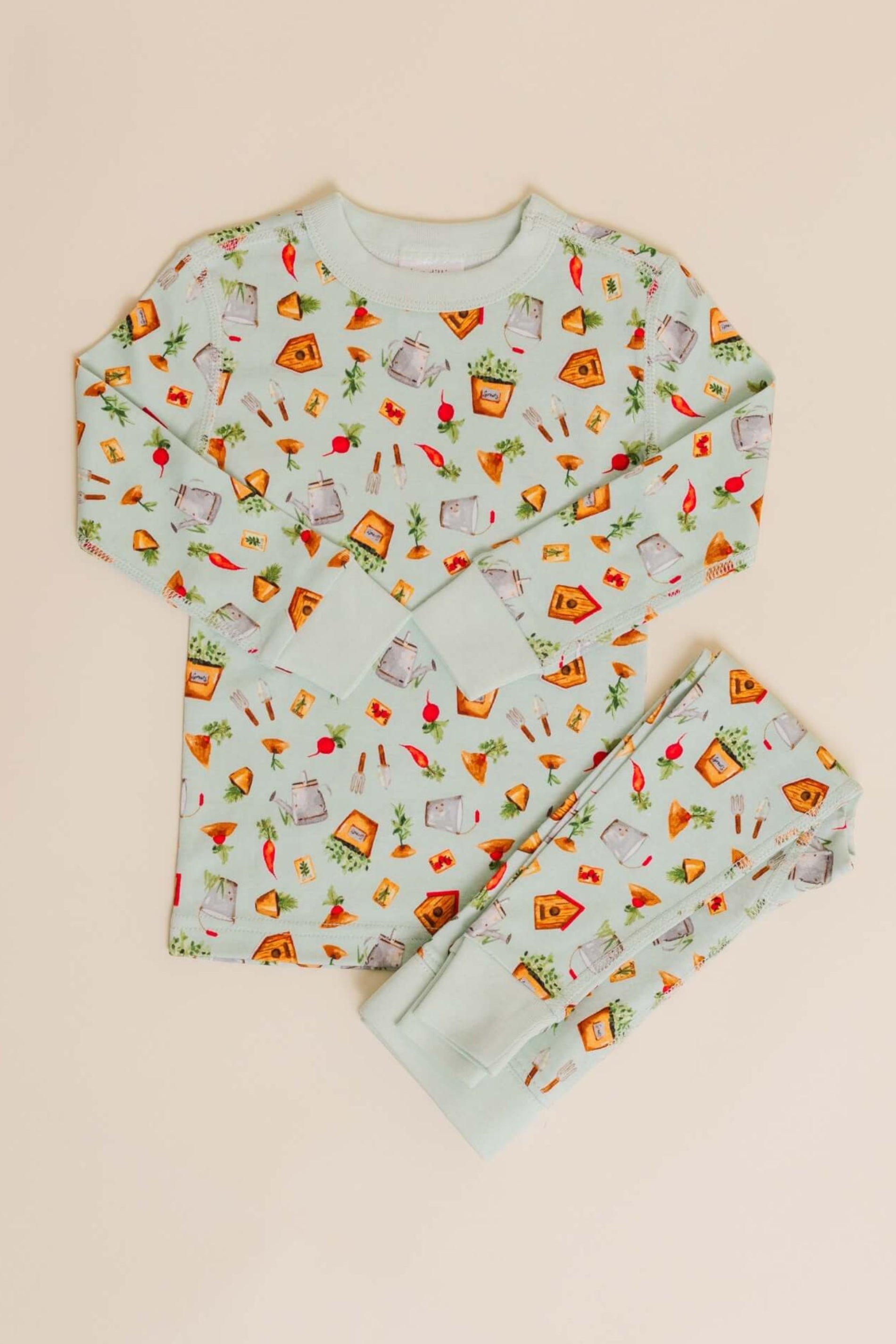 organic cotton children's long sleeve sleepwear in green garden print designed by cris rogerson