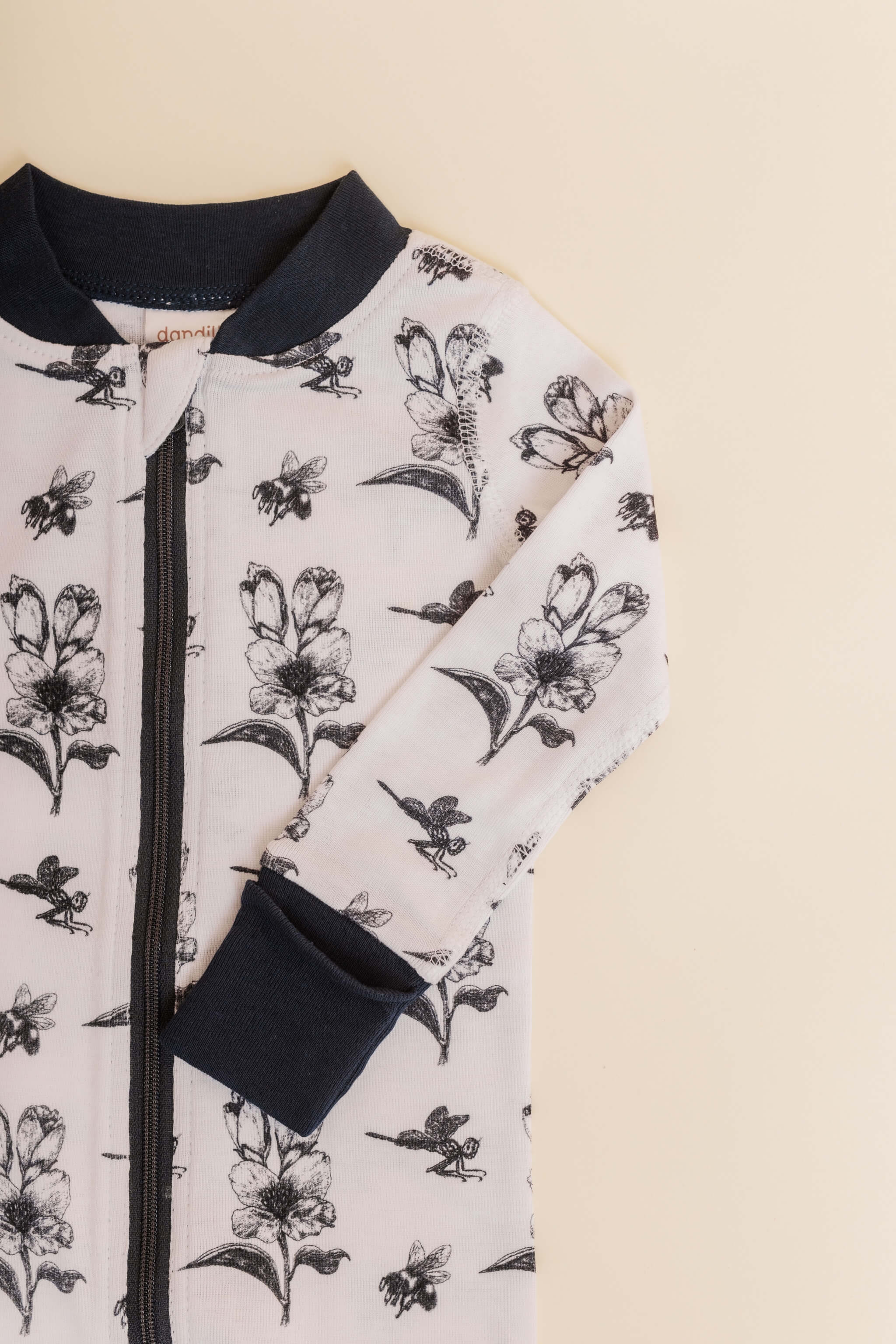 organic cotton baby zipper sleeper with fold-over cuffs in black ink print designed by chewie co