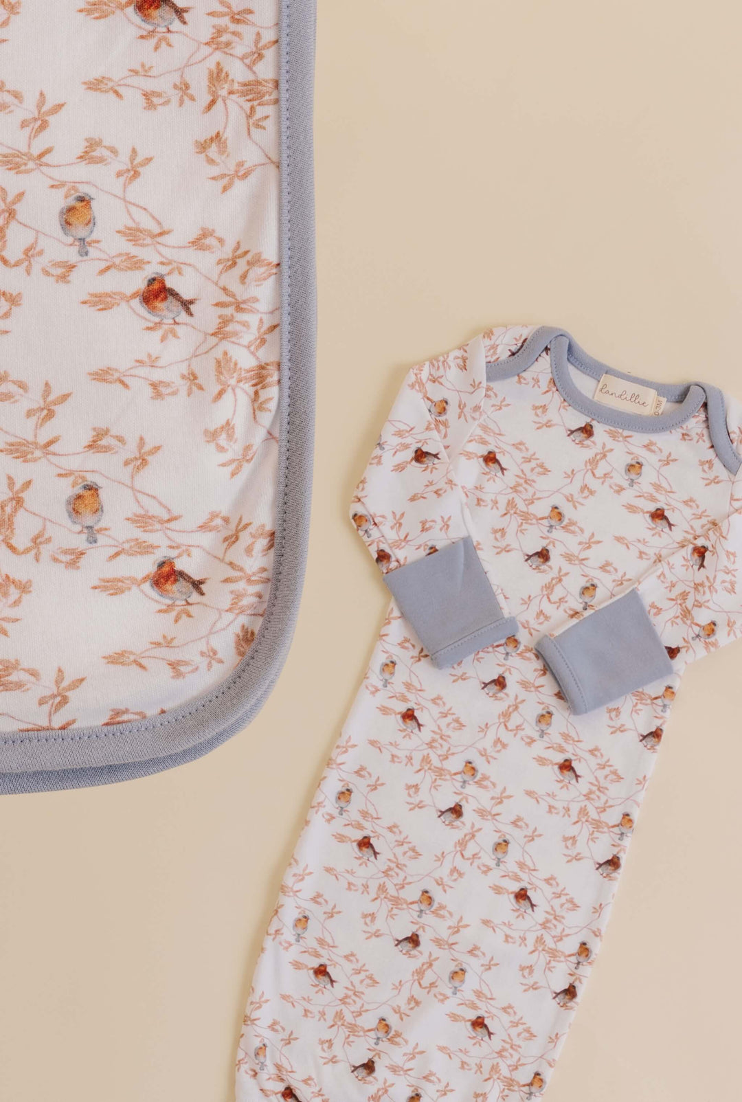 Swaddle and baby gown with bird pattern