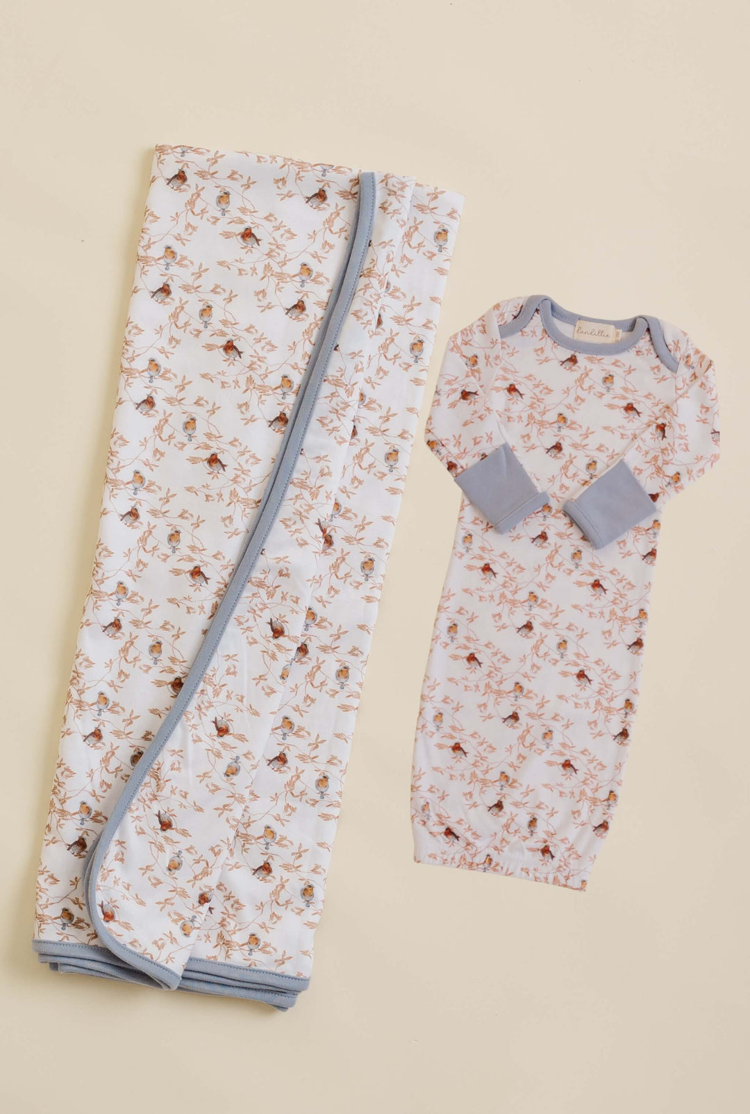 Swaddle and baby gown with bird pattern