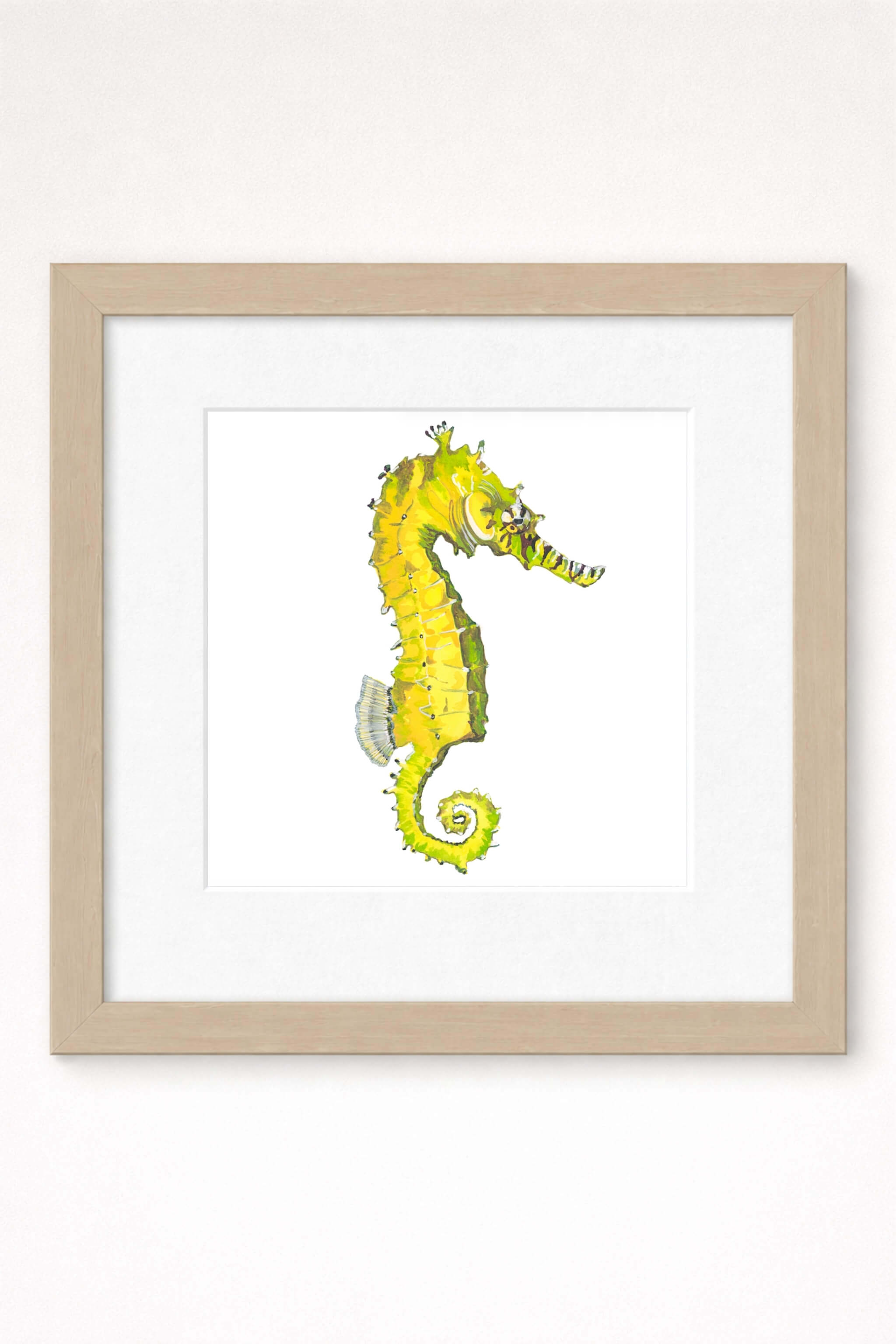 giclee print of watercolor painting of yellow seahorse by emily bourassa in brown frame