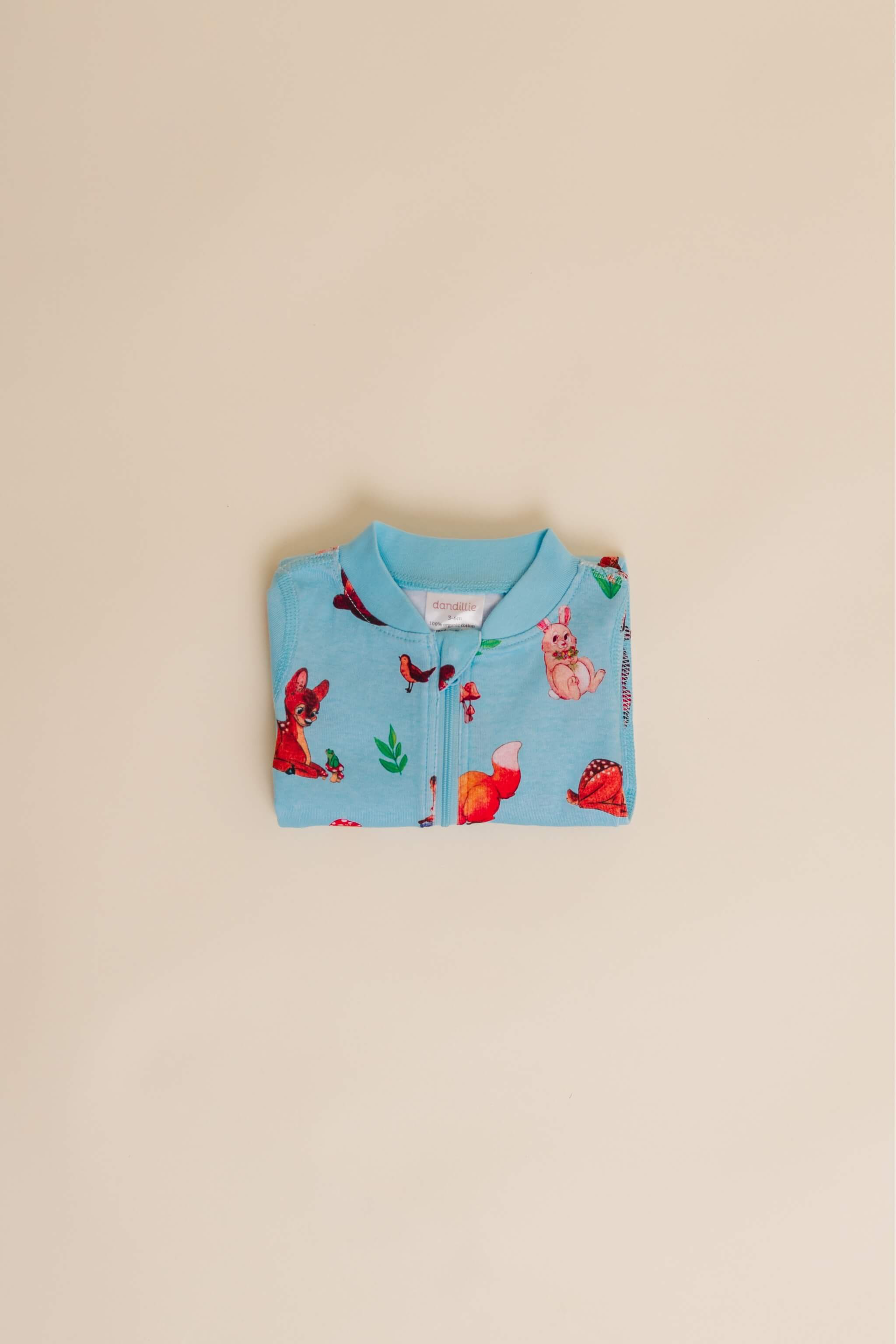 organic cotton baby zipper sleeper with fold-over cuffs in blue animal print designed by anna iwin