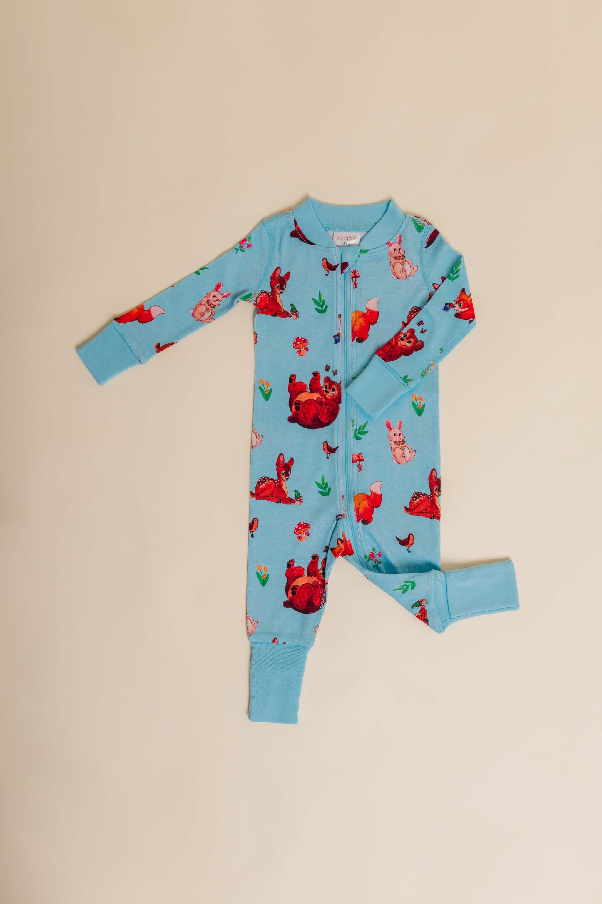 organic cotton baby zipper sleeper with fold-over cuffs in blue animal print designed by anna iwin
