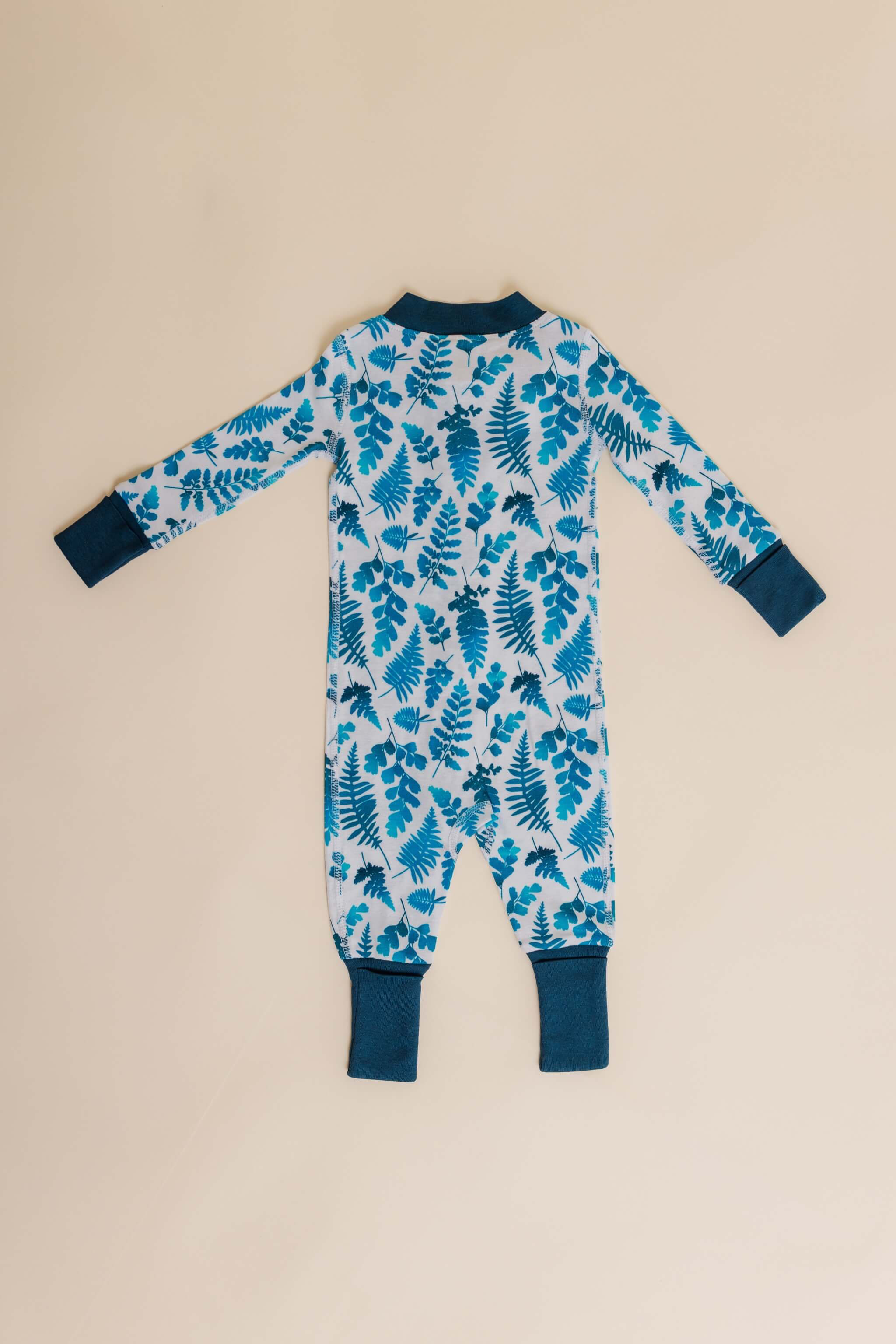 organic cotton baby zipper sleeper with fold-over cuffs in blue fern print designed by jen johnston