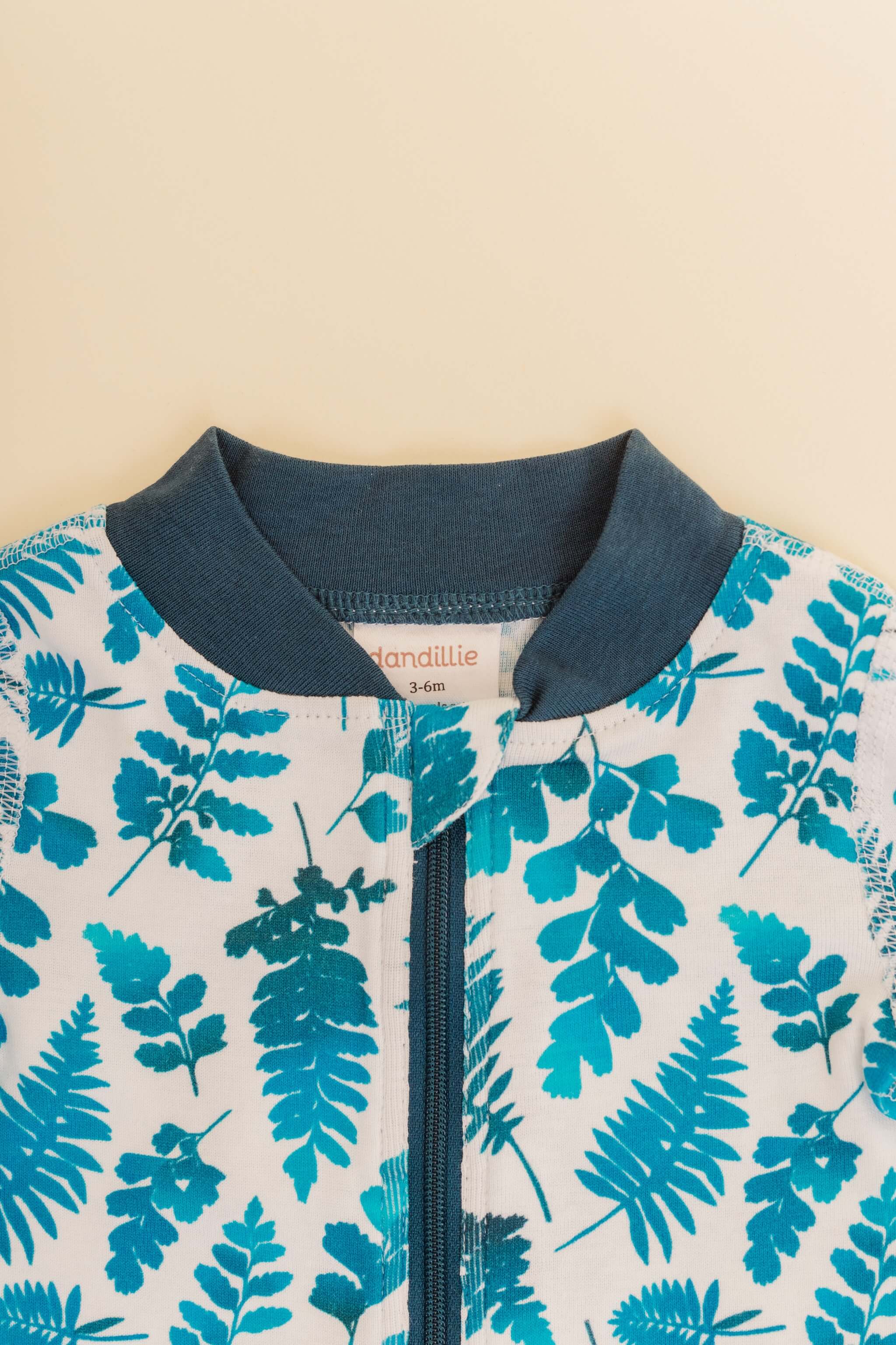 organic cotton baby zipper sleeper with fold-over cuffs in blue fern print designed by jen johnston