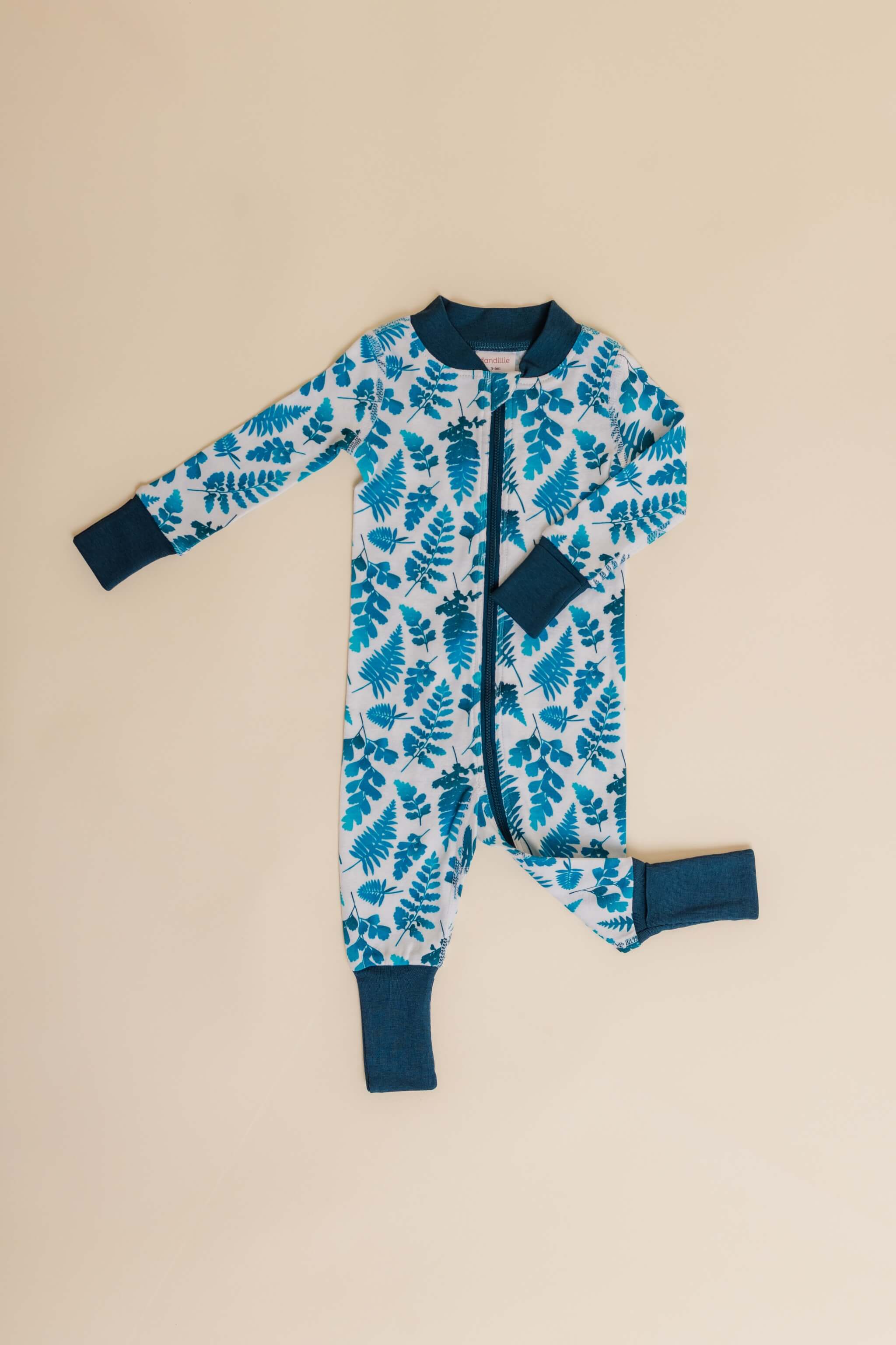organic cotton baby zipper sleeper with fold-over cuffs in blue fern print designed by jen johnston