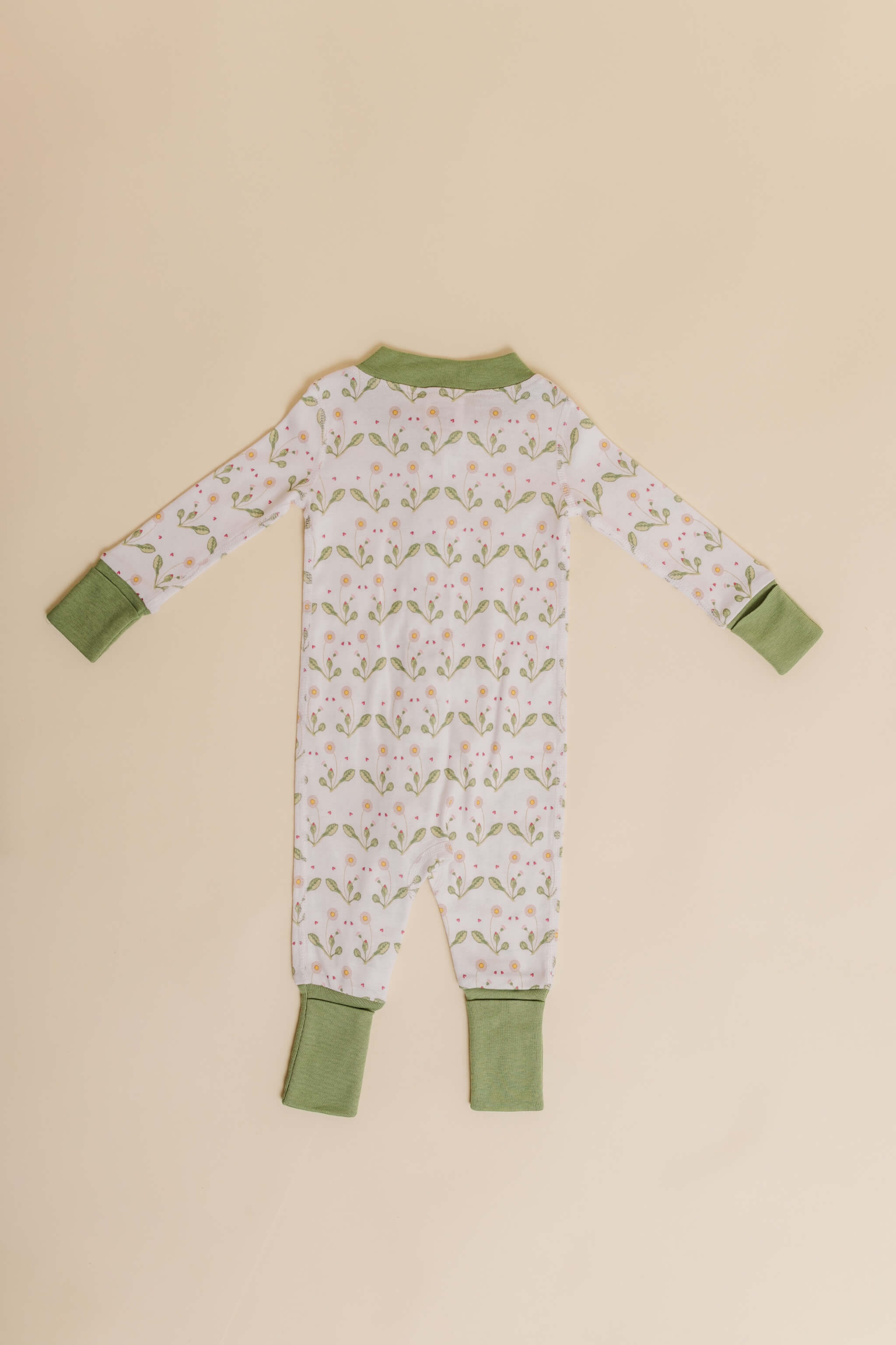 organic cotton baby zipper sleeper with fold-over cuffs in green daisy print designed by giacomina ferrillo