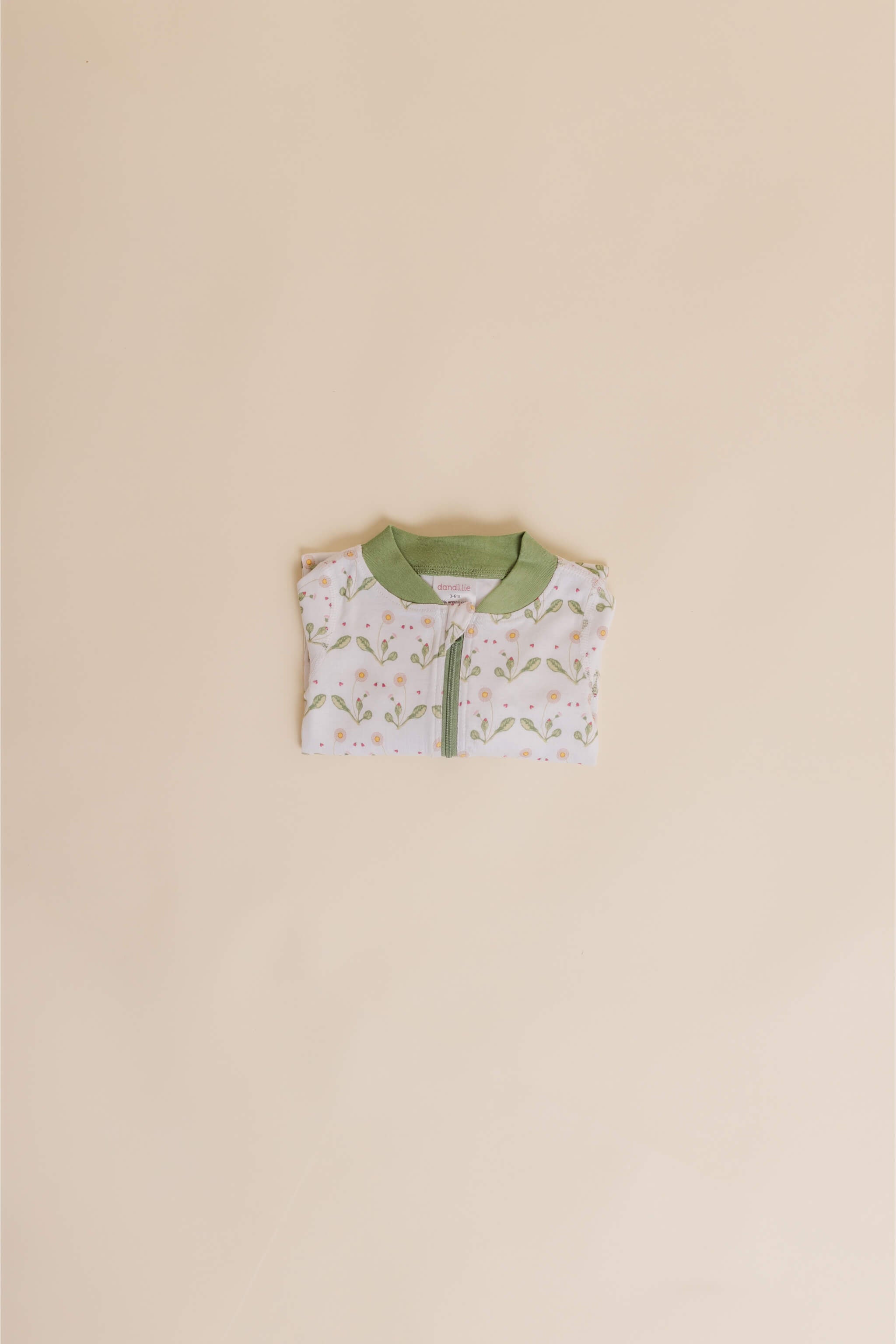 organic cotton baby zipper sleeper with fold-over cuffs in green daisy print designed by giacomina ferrillo