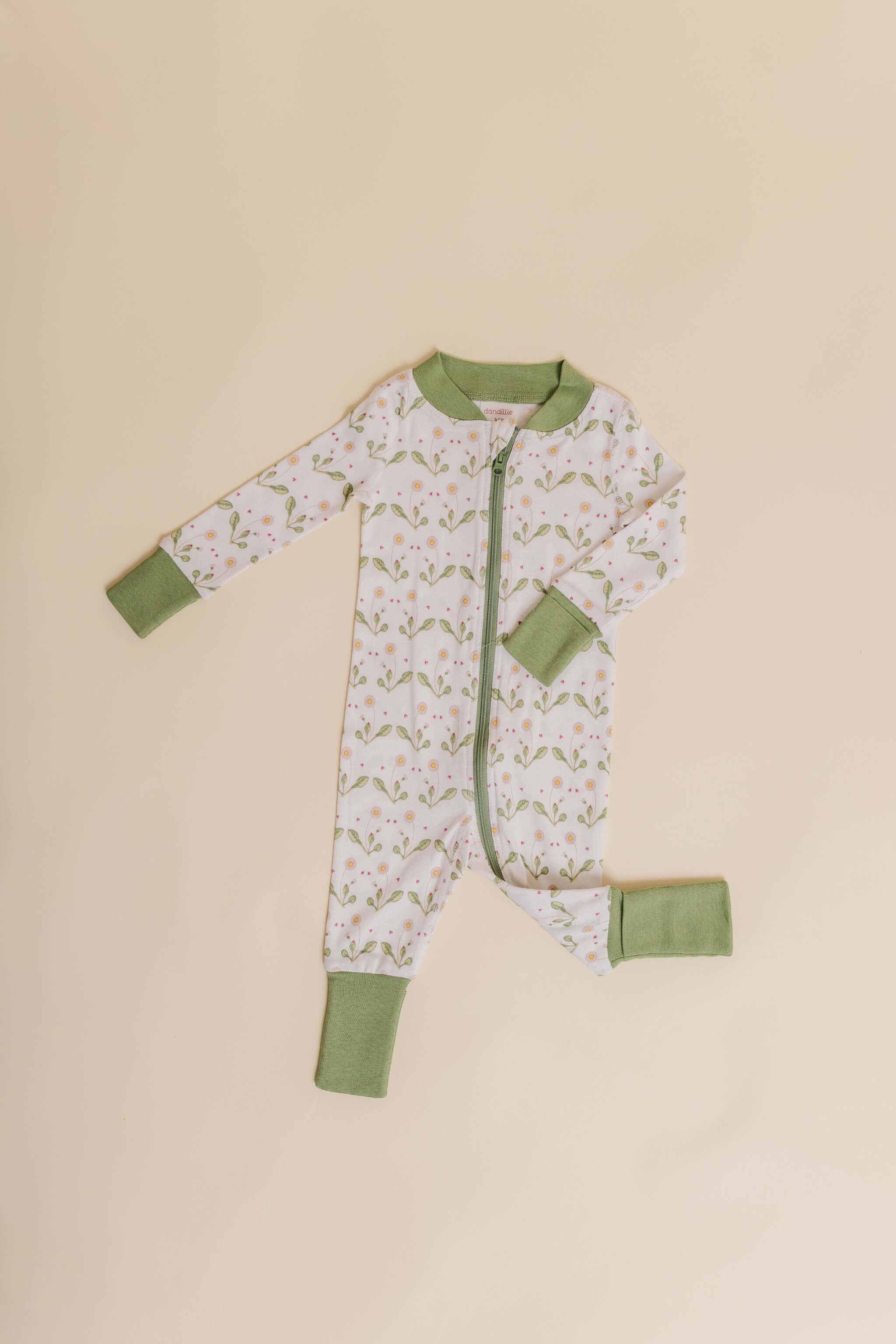 organic cotton baby zipper sleeper with fold-over cuffs in green daisy print designed by giacomina ferrillo