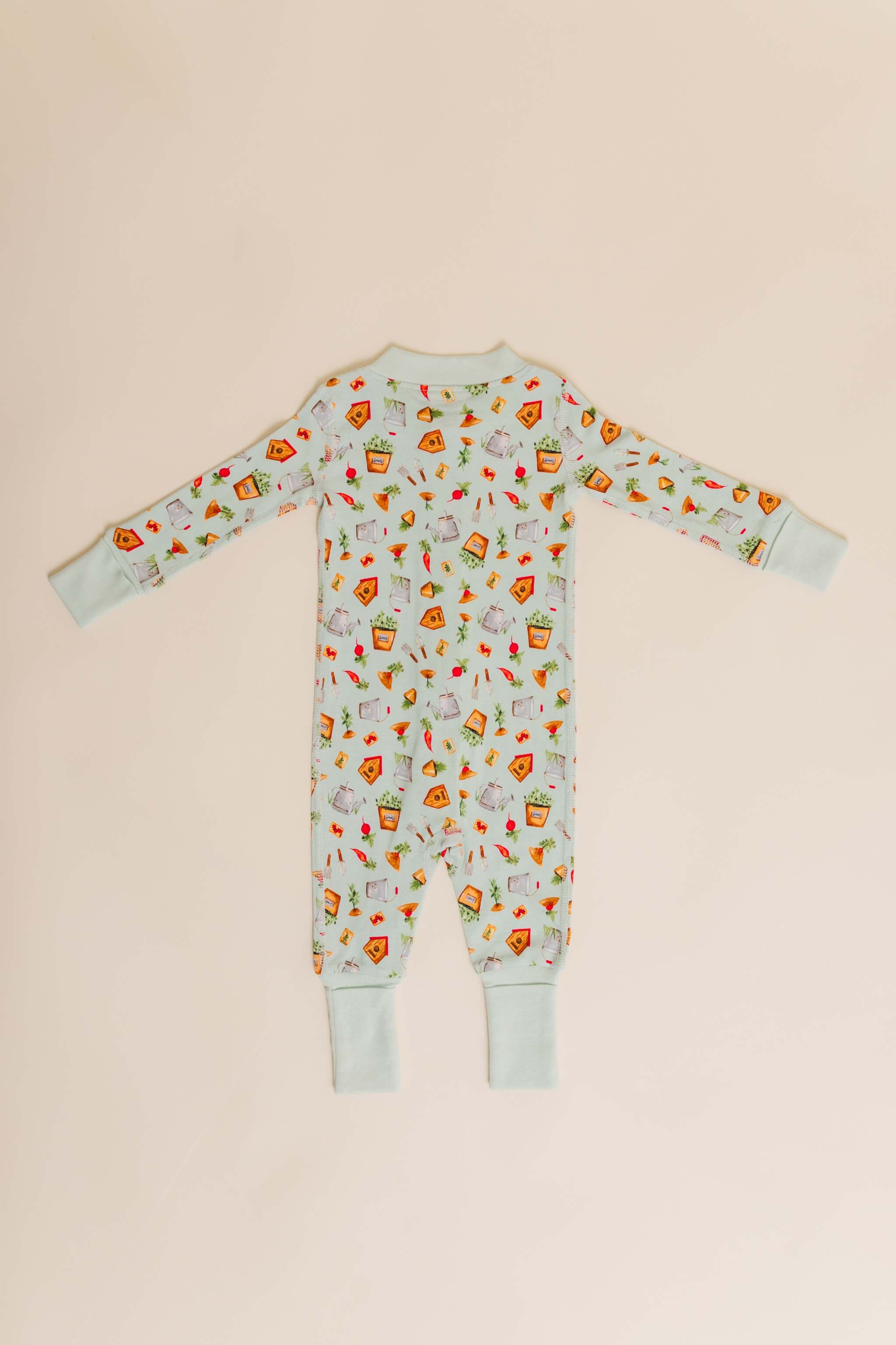 organic cotton baby zipper sleeper with fold-over cuffs in green garden print designed by cris rogerson
