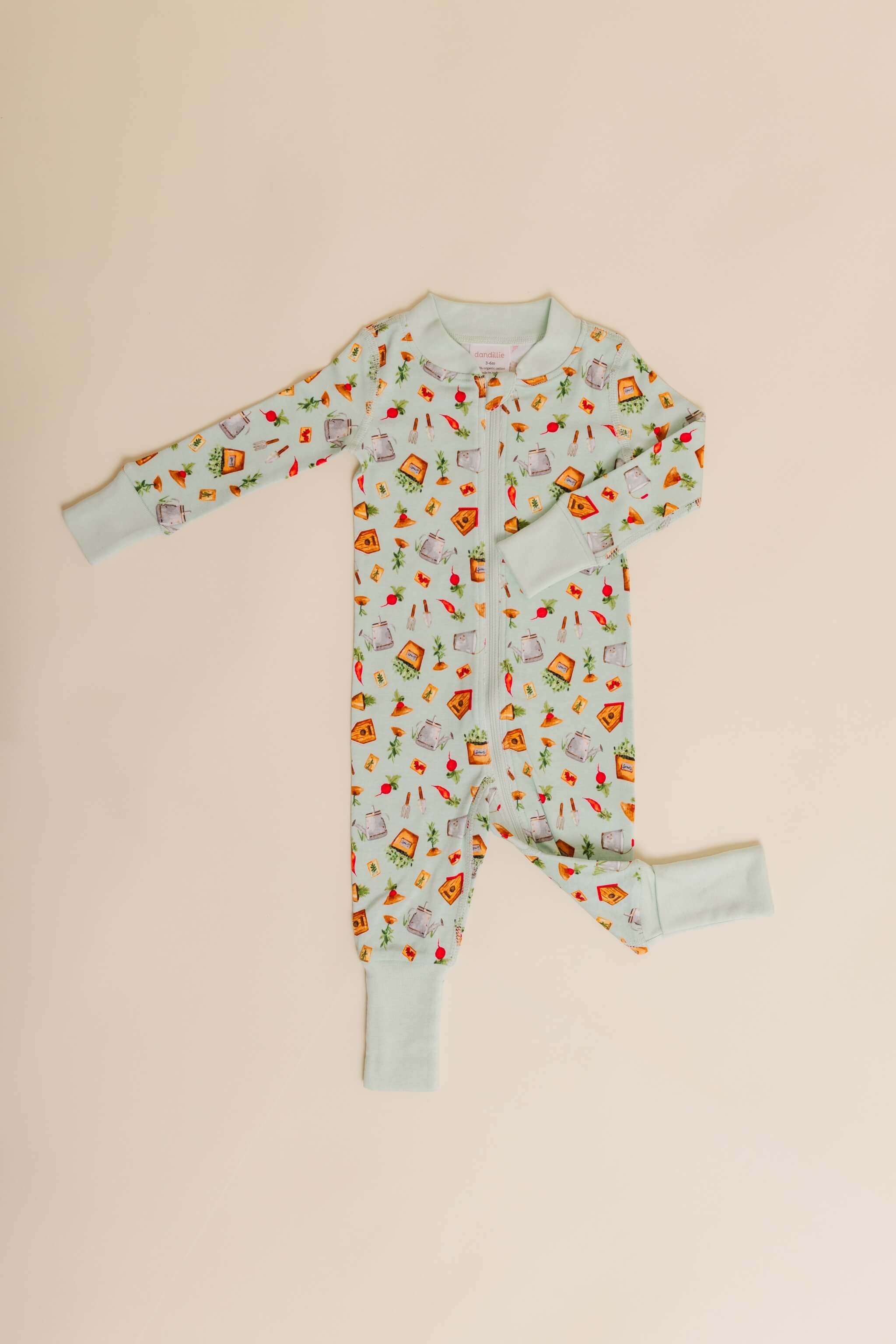 organic cotton baby zipper sleeper with fold-over cuffs in green garden print designed by cris rogerson