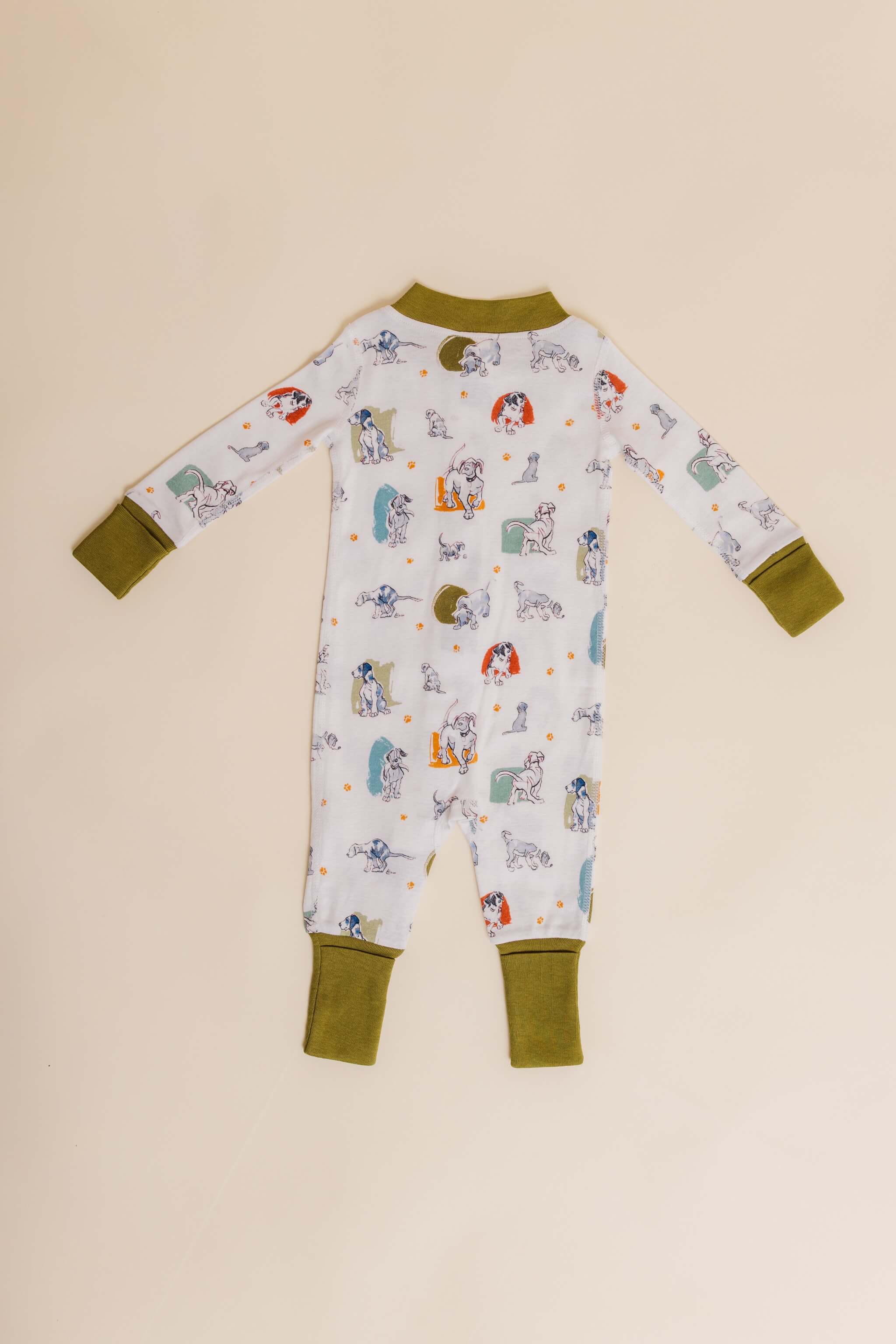 organic cotton baby zipper sleeper with fold-over cuffs in green puppy print designed by jen brandon
