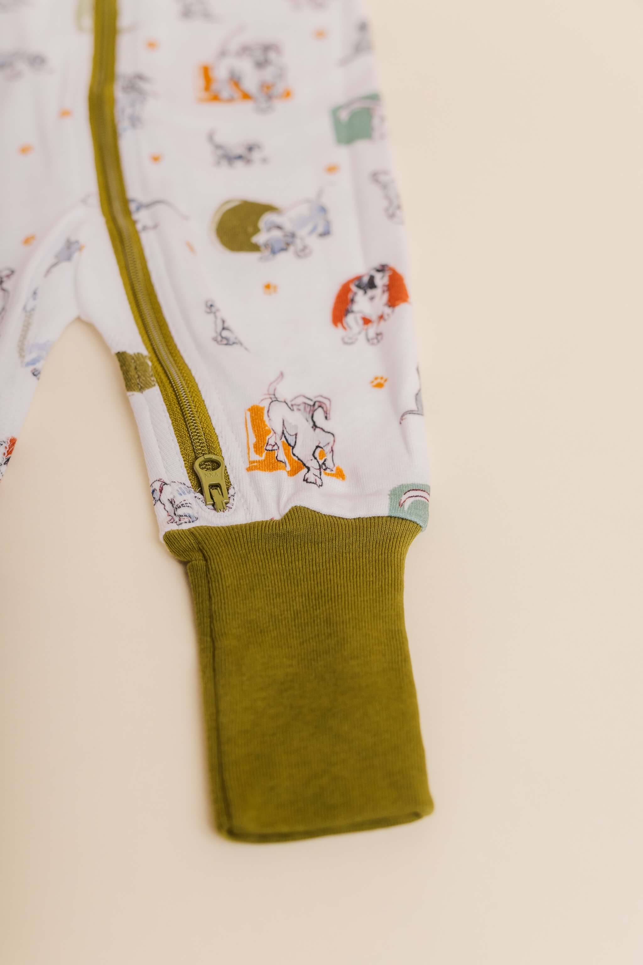 organic cotton baby zipper sleeper with fold-over cuffs in green puppy print designed by jen brandon