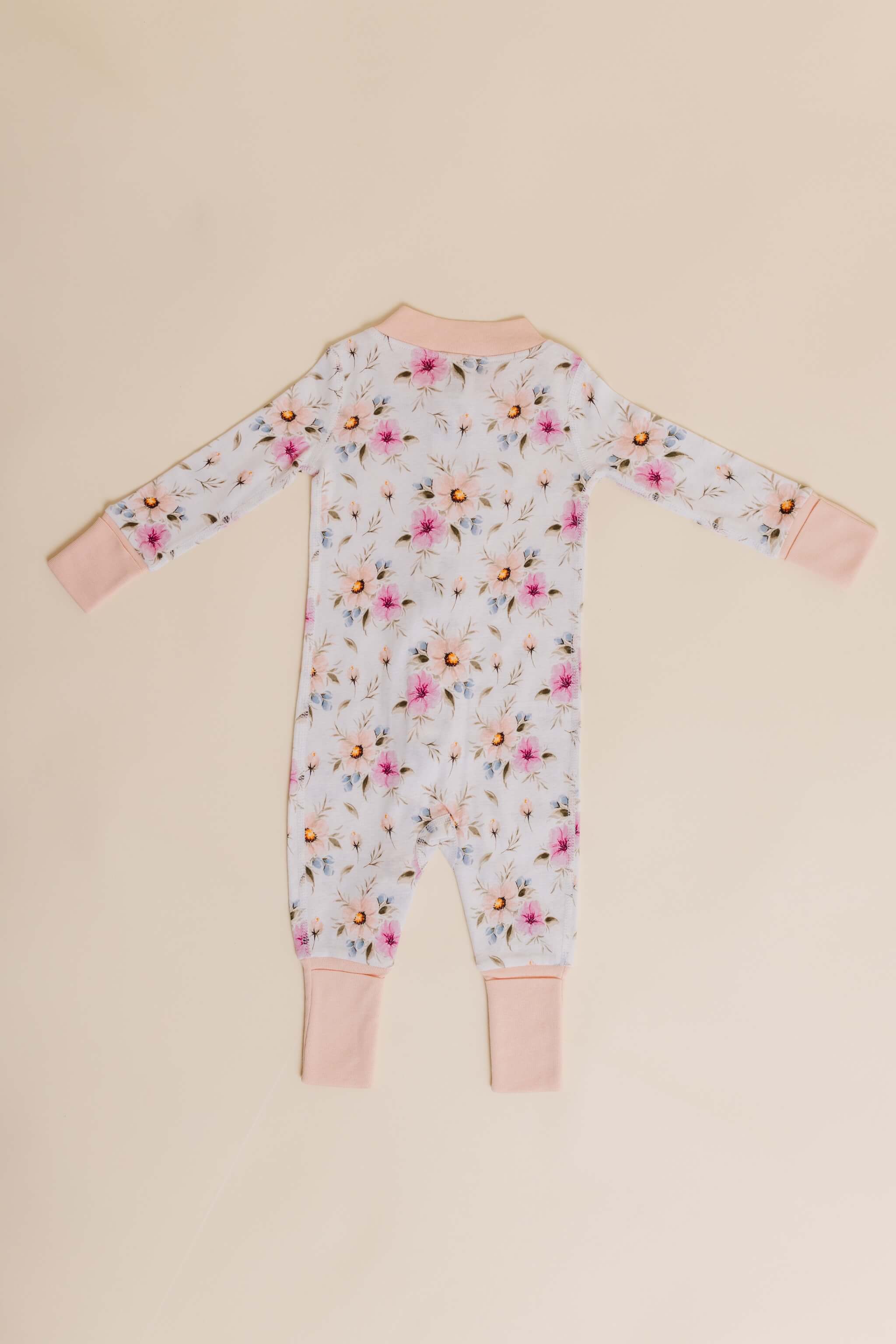 organic cotton baby zipper sleeper with fold-over cuffs in coral floral print designed by jen sweeney