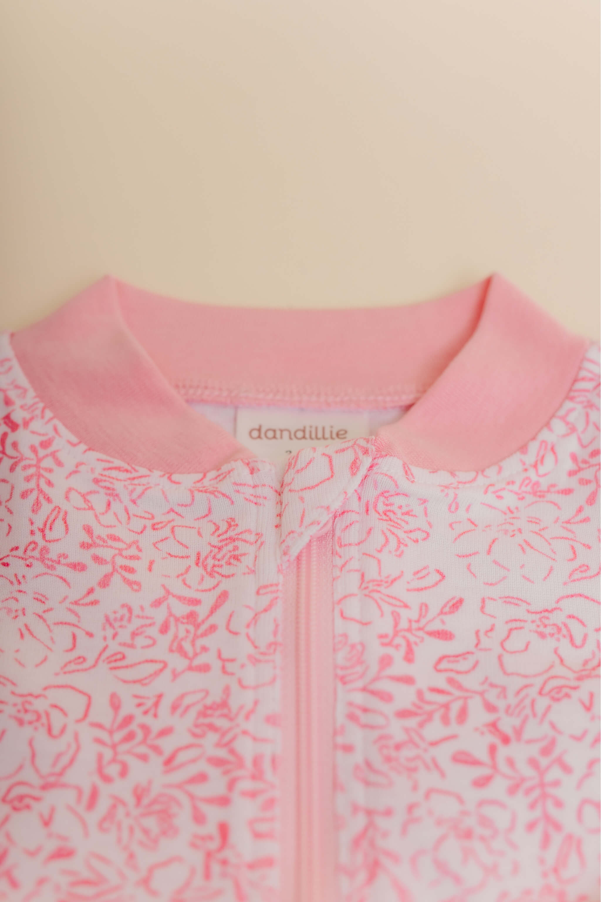 organic cotton baby zipper sleeper with fold-over cuffs in pink floral print designed by eliza baucom