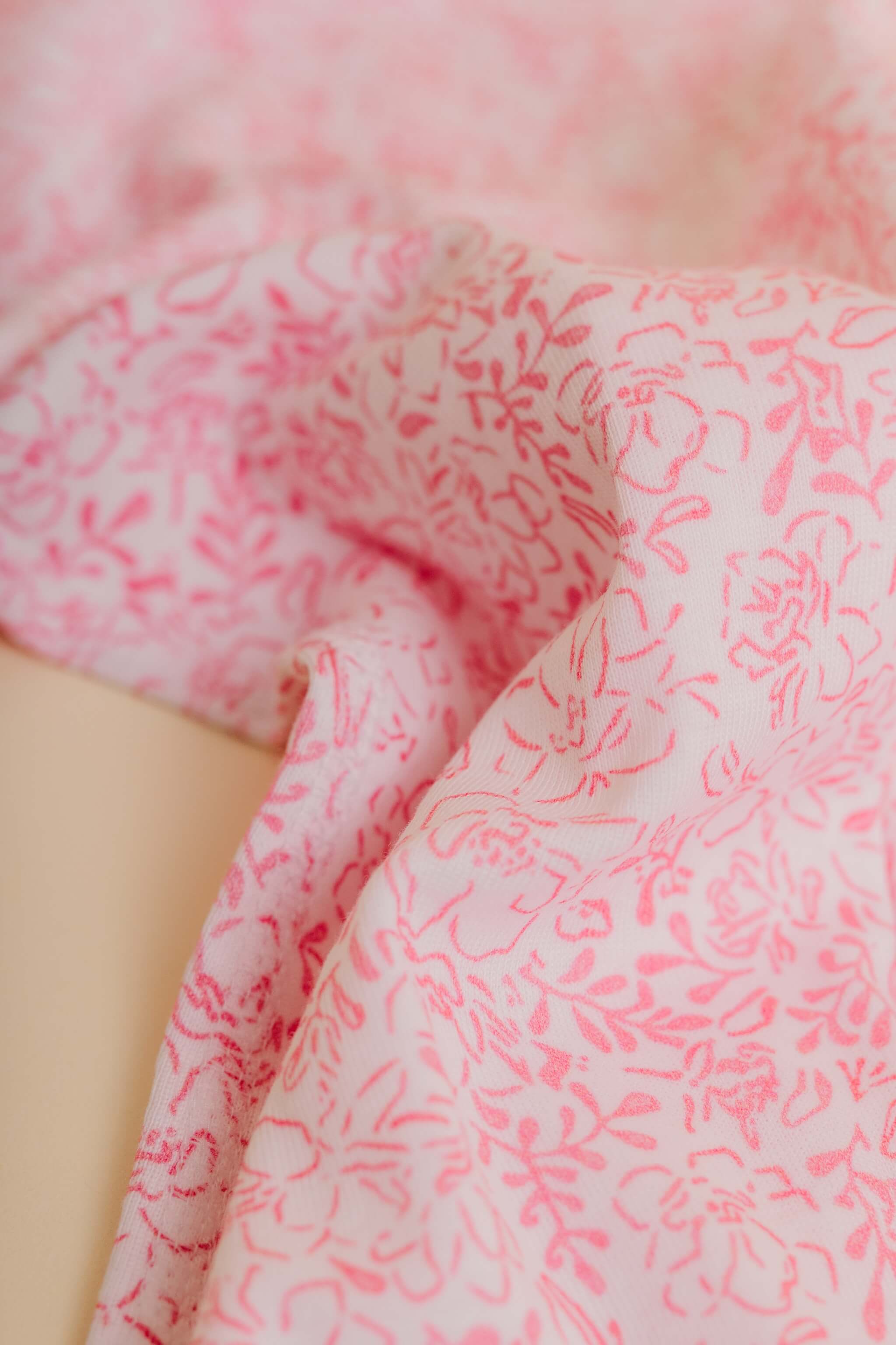 organic cotton baby zipper sleeper with fold-over cuffs in pink floral print designed by eliza baucom