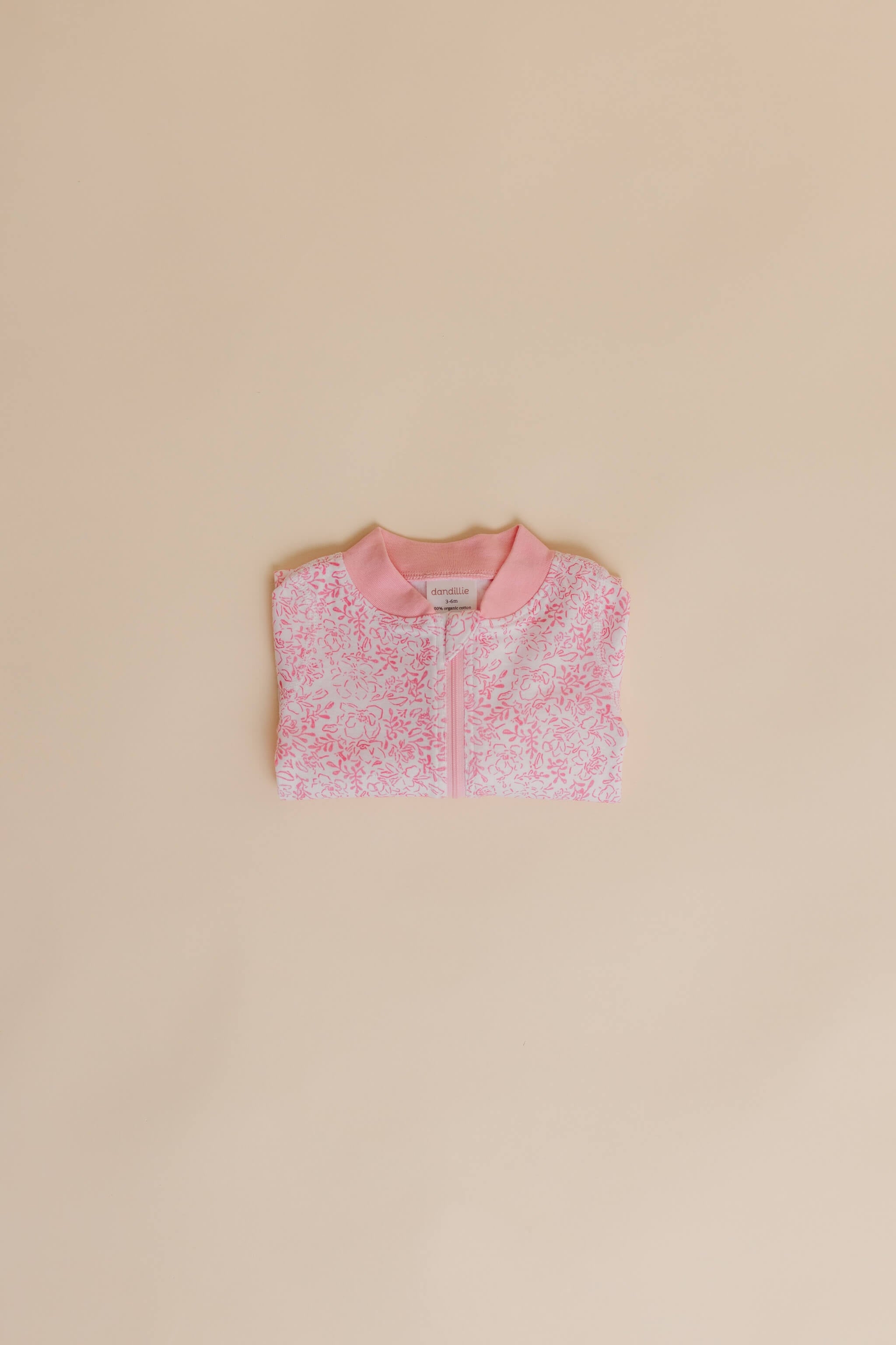 organic cotton baby zipper sleeper with fold-over cuffs in pink floral print designed by eliza baucom