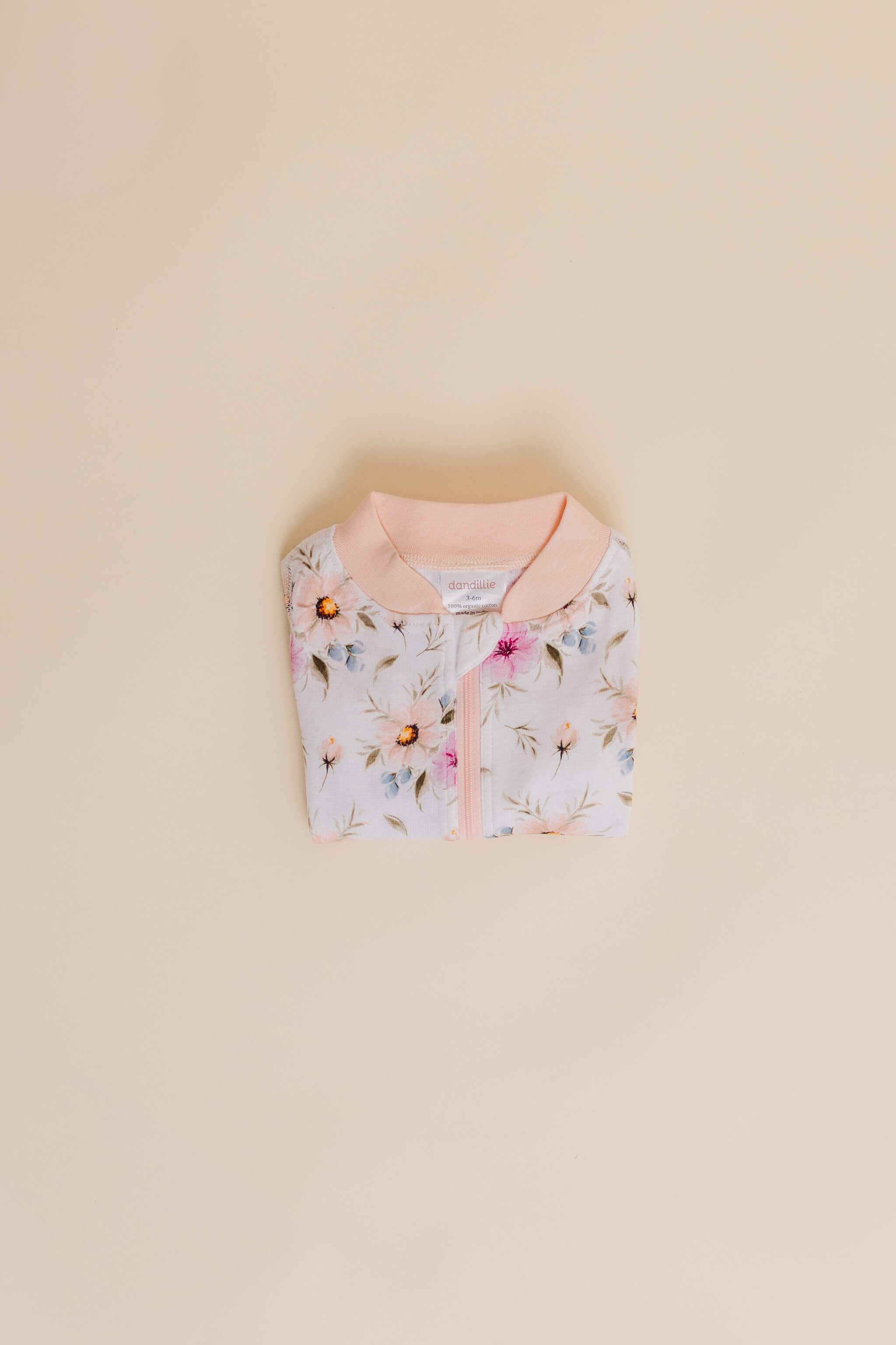 organic cotton baby zipper sleeper with fold-over cuffs in coral floral print designed by jen sweeney