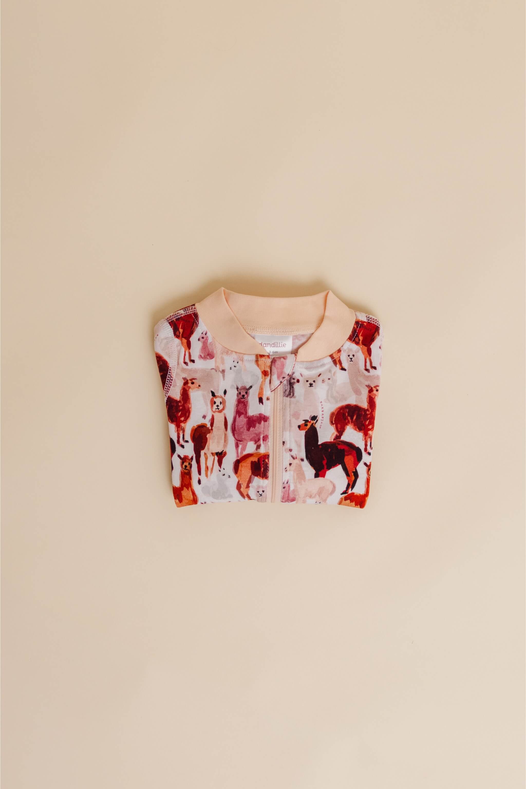 organic cotton baby zipper sleeper with fold-over cuffs in tan alpaca print designed by barbra ignatiev