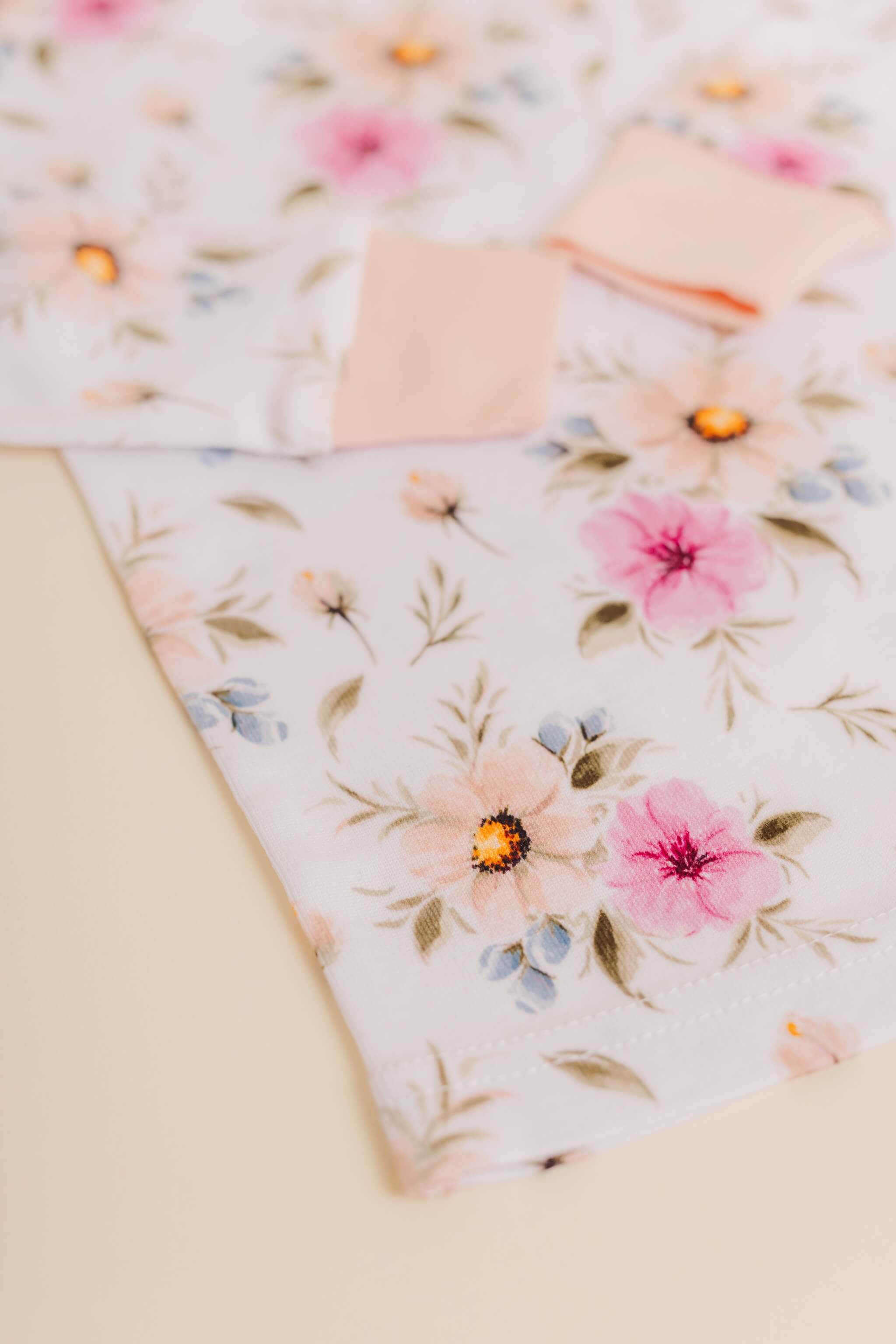 organic cotton children's long sleeve sleepwear in coral floral print designed by jen sweeeney