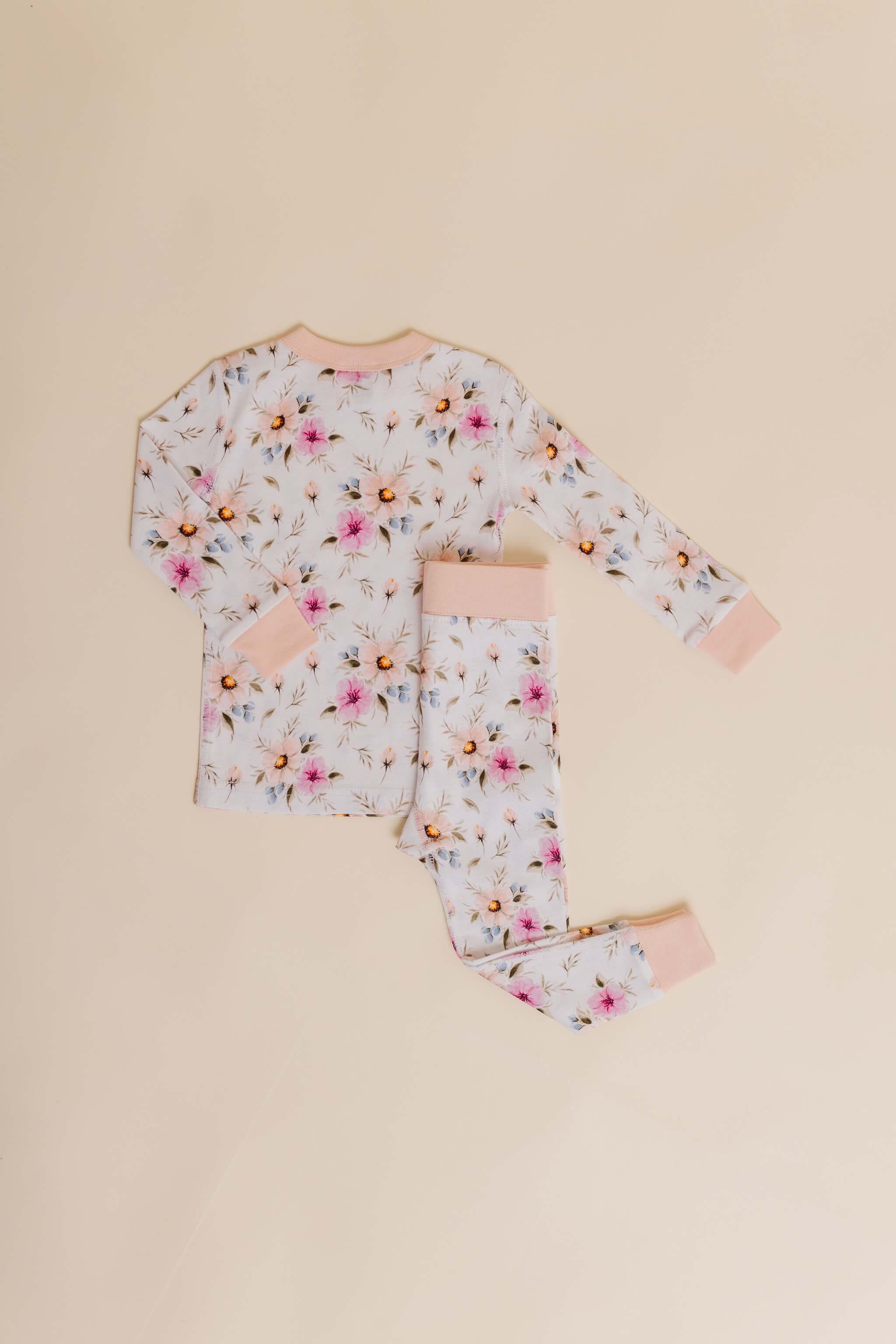 organic cotton children's long sleeve sleepwear in coral floral print designed by jen sweeeney
