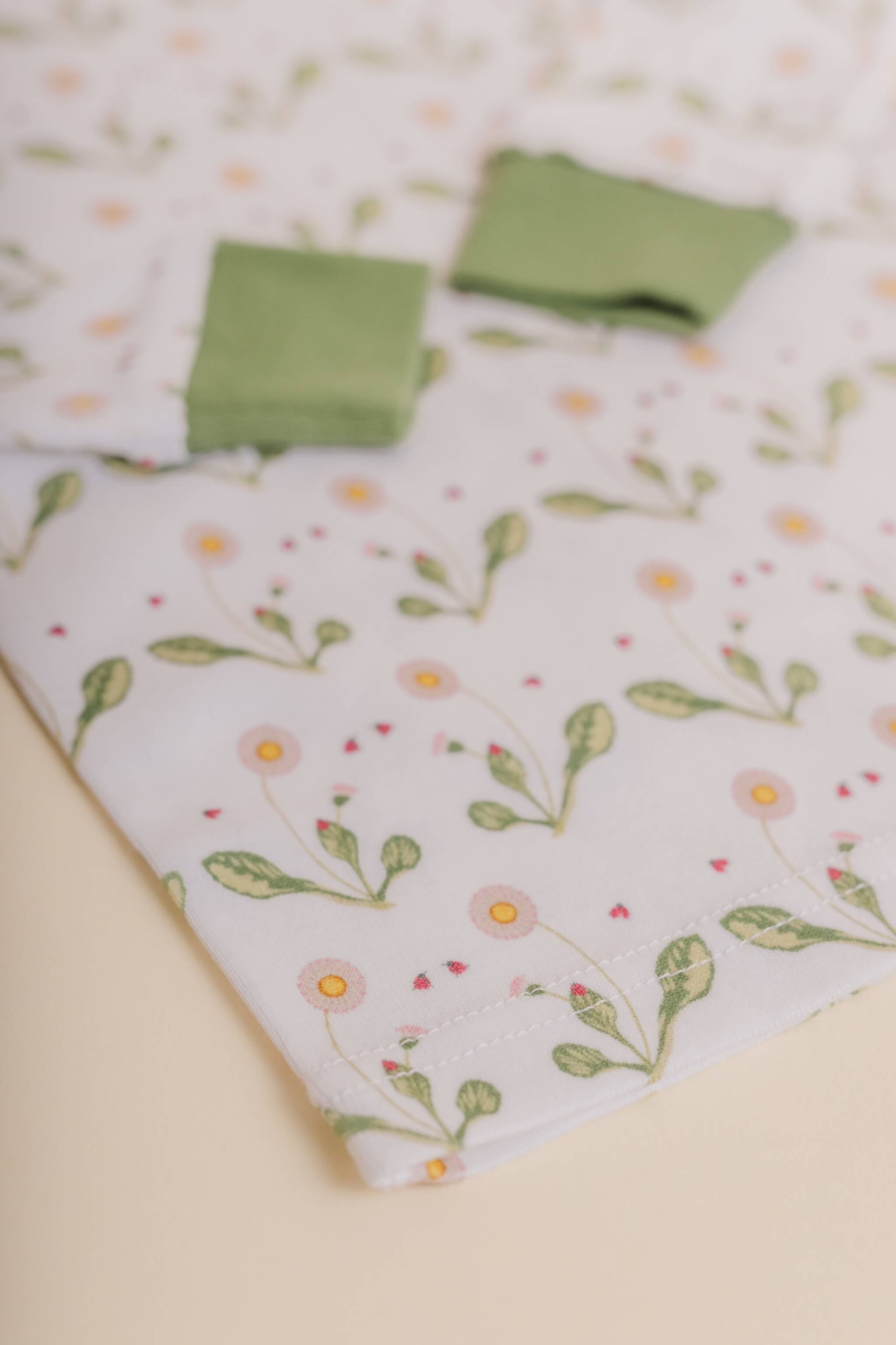 organic cotton children's long sleeve sleepwear in green daisy print designed by giacomina ferillo