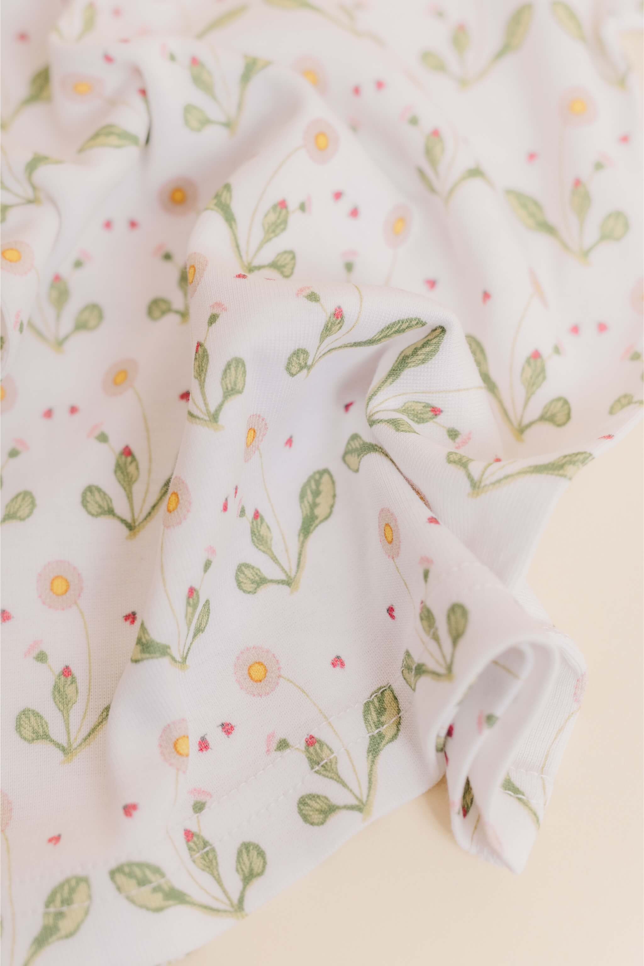 organic cotton children's long sleeve sleepwear in green daisy print designed by giacomina ferillo