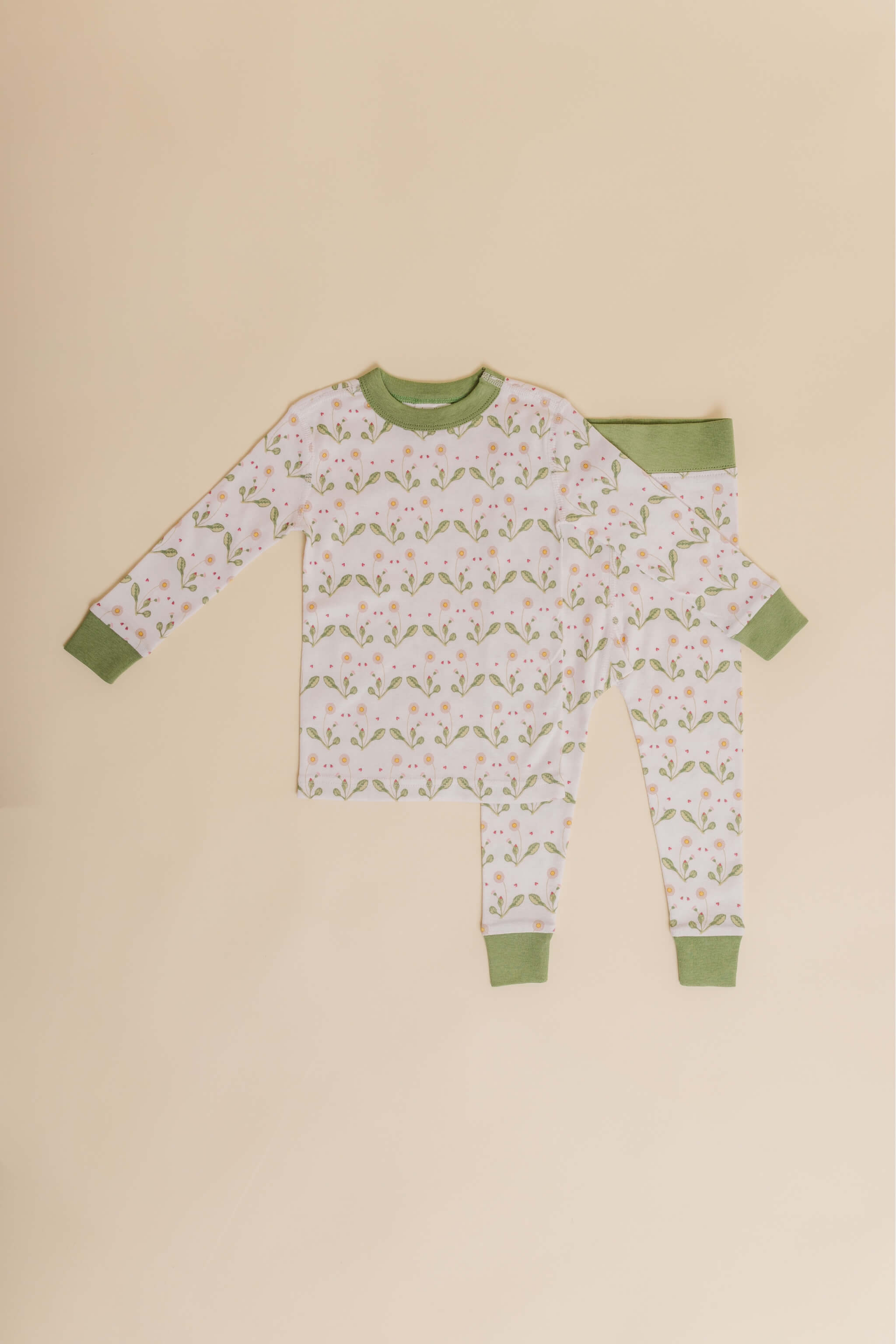 organic cotton children's long sleeve sleepwear in green daisy print designed by giacomina ferillo