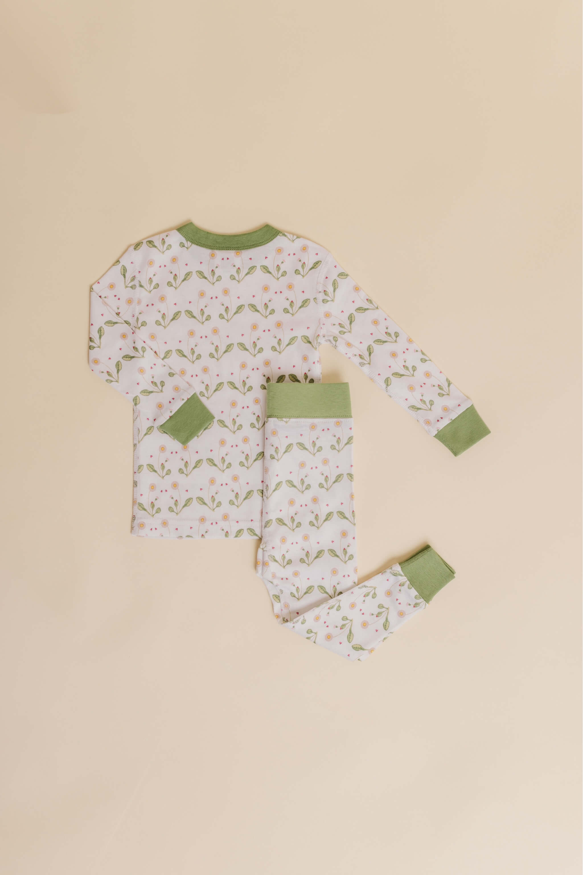 organic cotton children's long sleeve sleepwear in green daisy print designed by giacomina ferillo