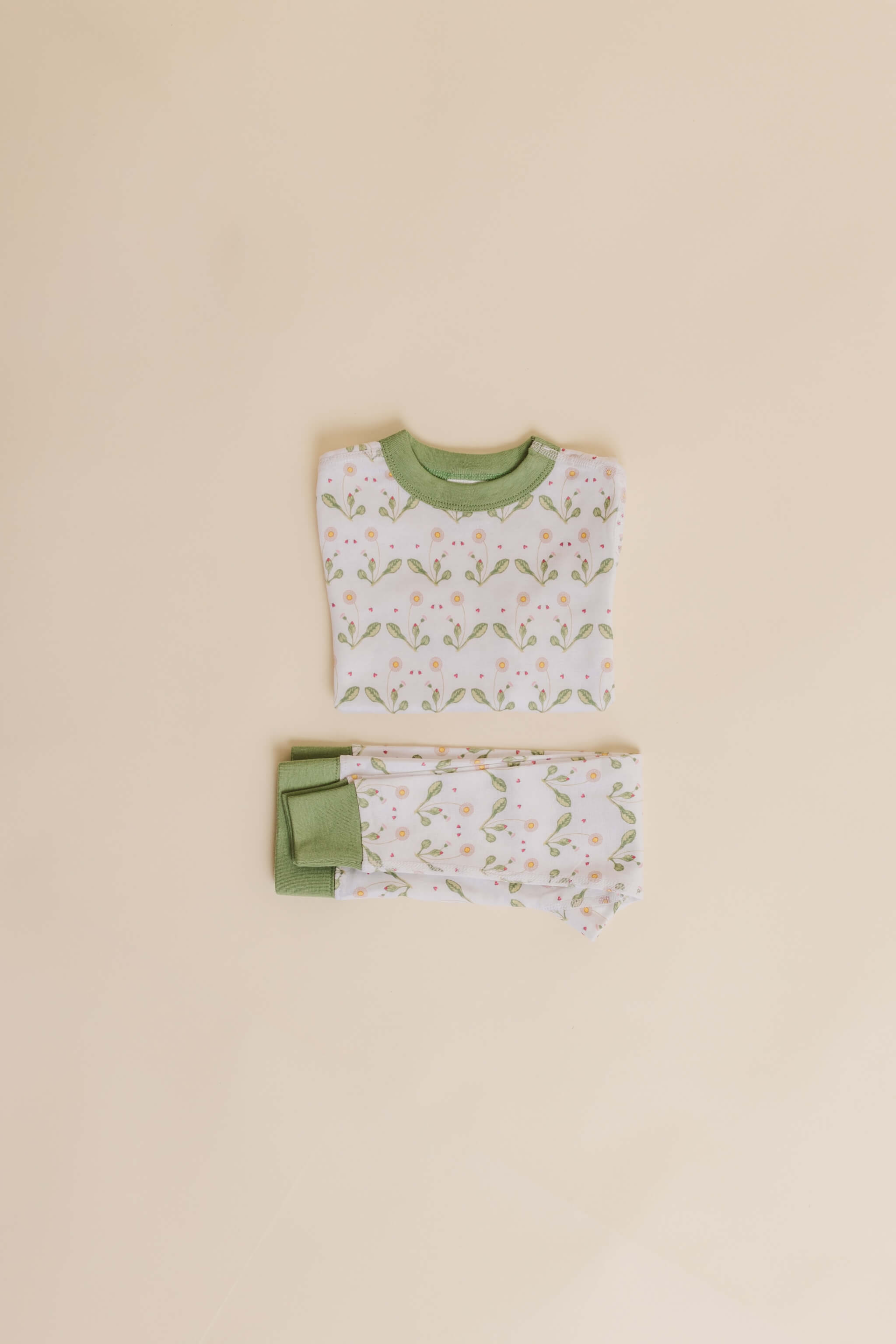 organic cotton children's long sleeve sleepwear in green daisy print designed by giacomina ferillo
