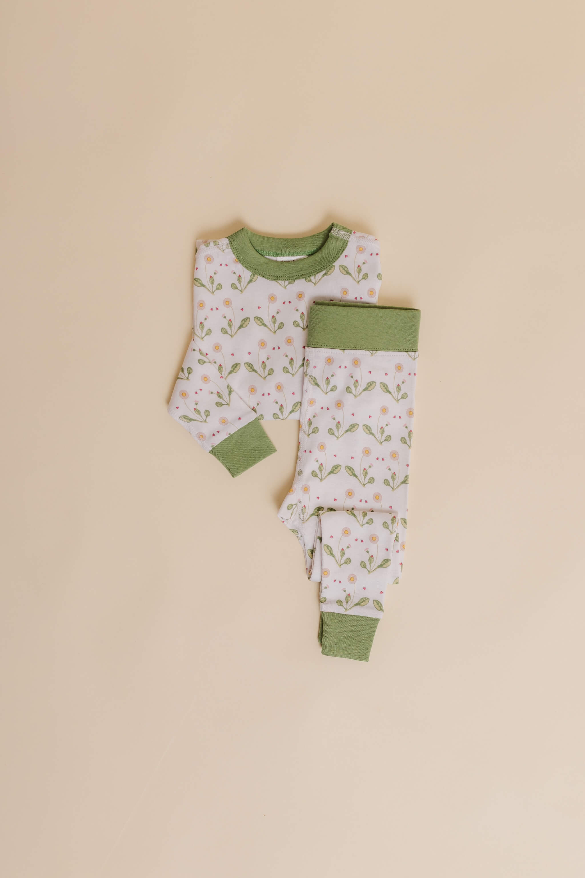 organic cotton children's long sleeve sleepwear in green daisy print designed by giacomina ferillo