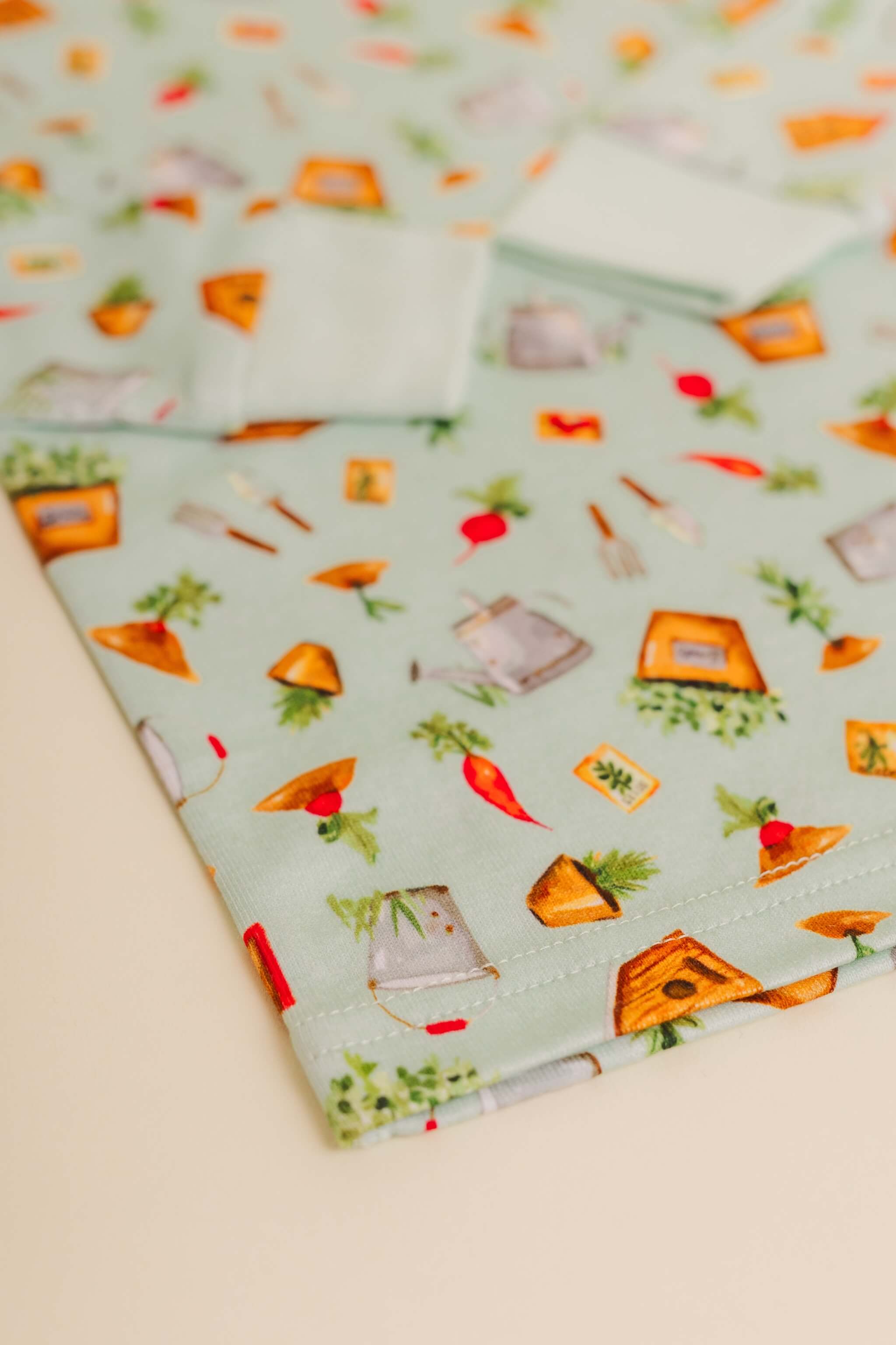 organic cotton children's long sleeve sleepwear in green garden print designed by cris rogerson