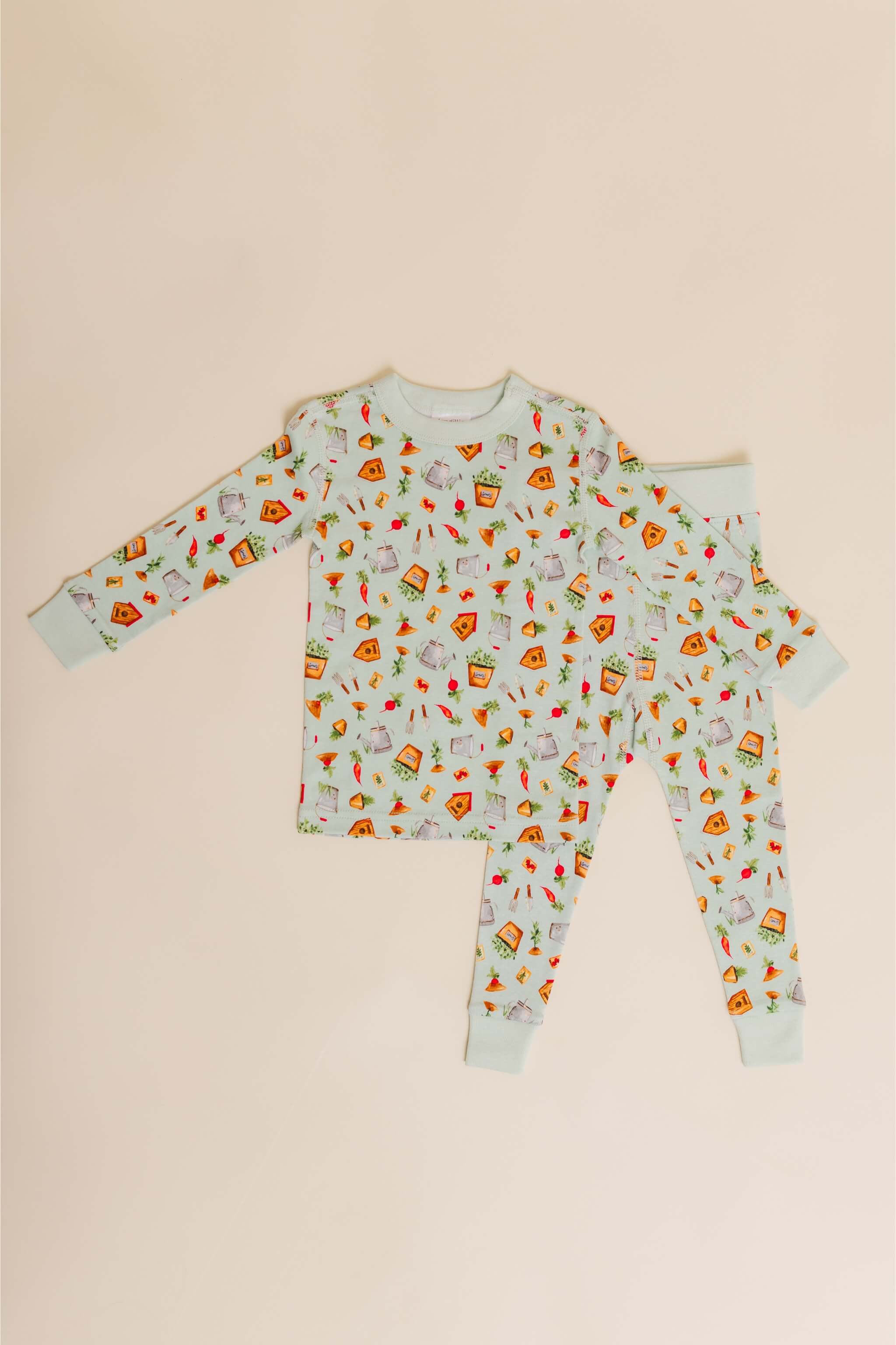organic cotton children's long sleeve sleepwear in green garden print designed by cris rogerson