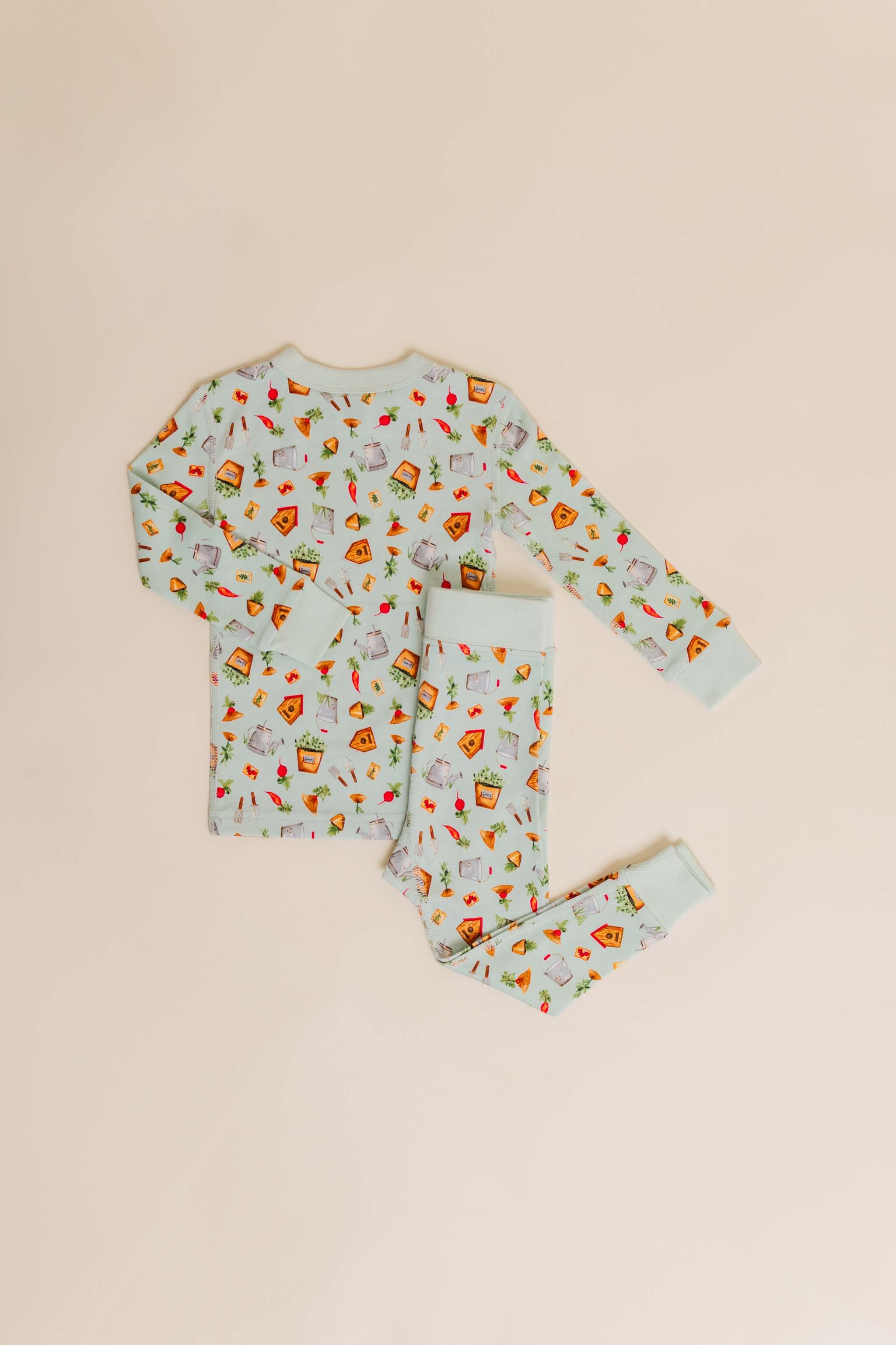 organic cotton children's long sleeve sleepwear in green garden print designed by cris rogerson