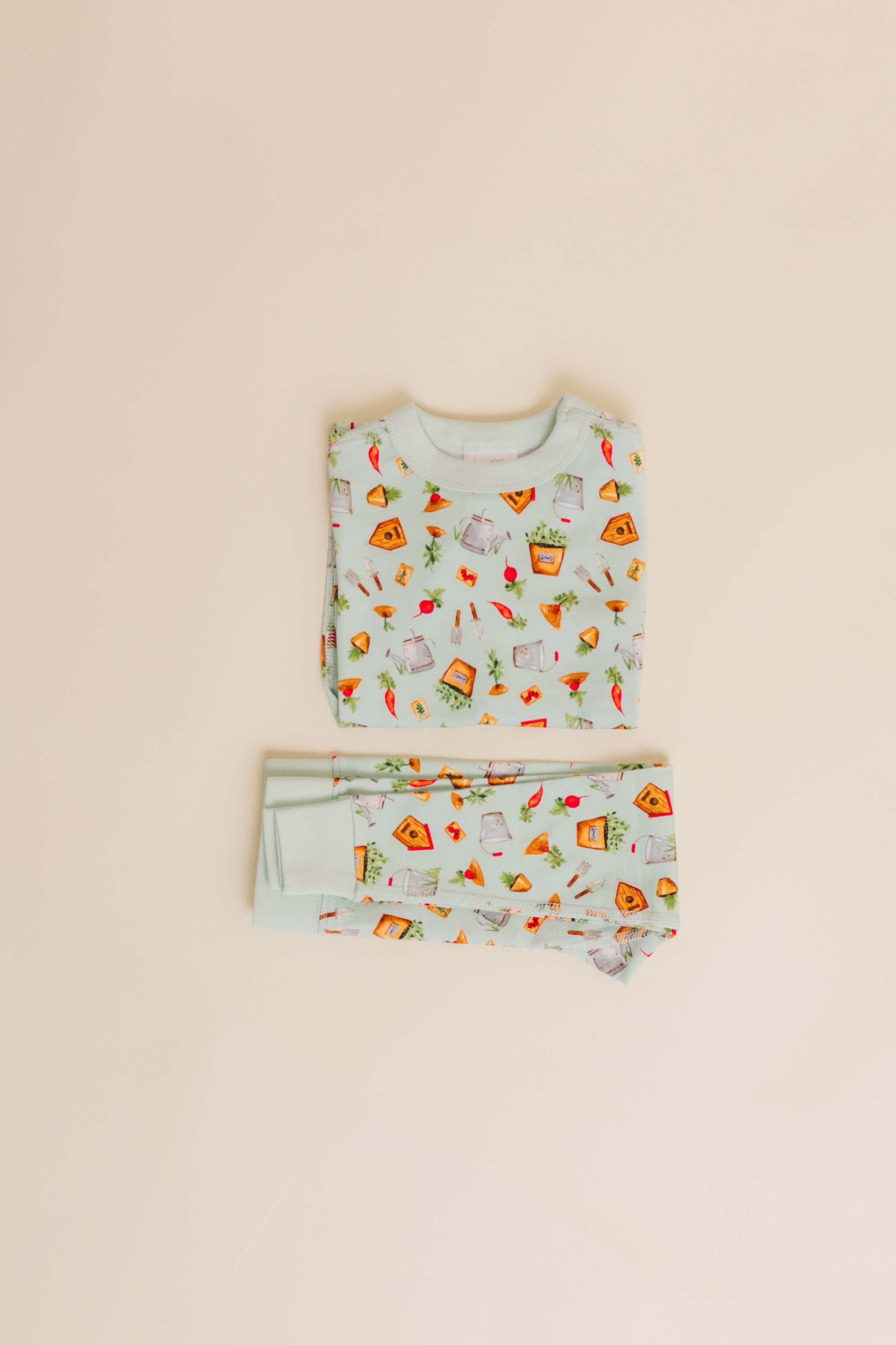 organic cotton children's long sleeve sleepwear in green garden print designed by cris rogerson