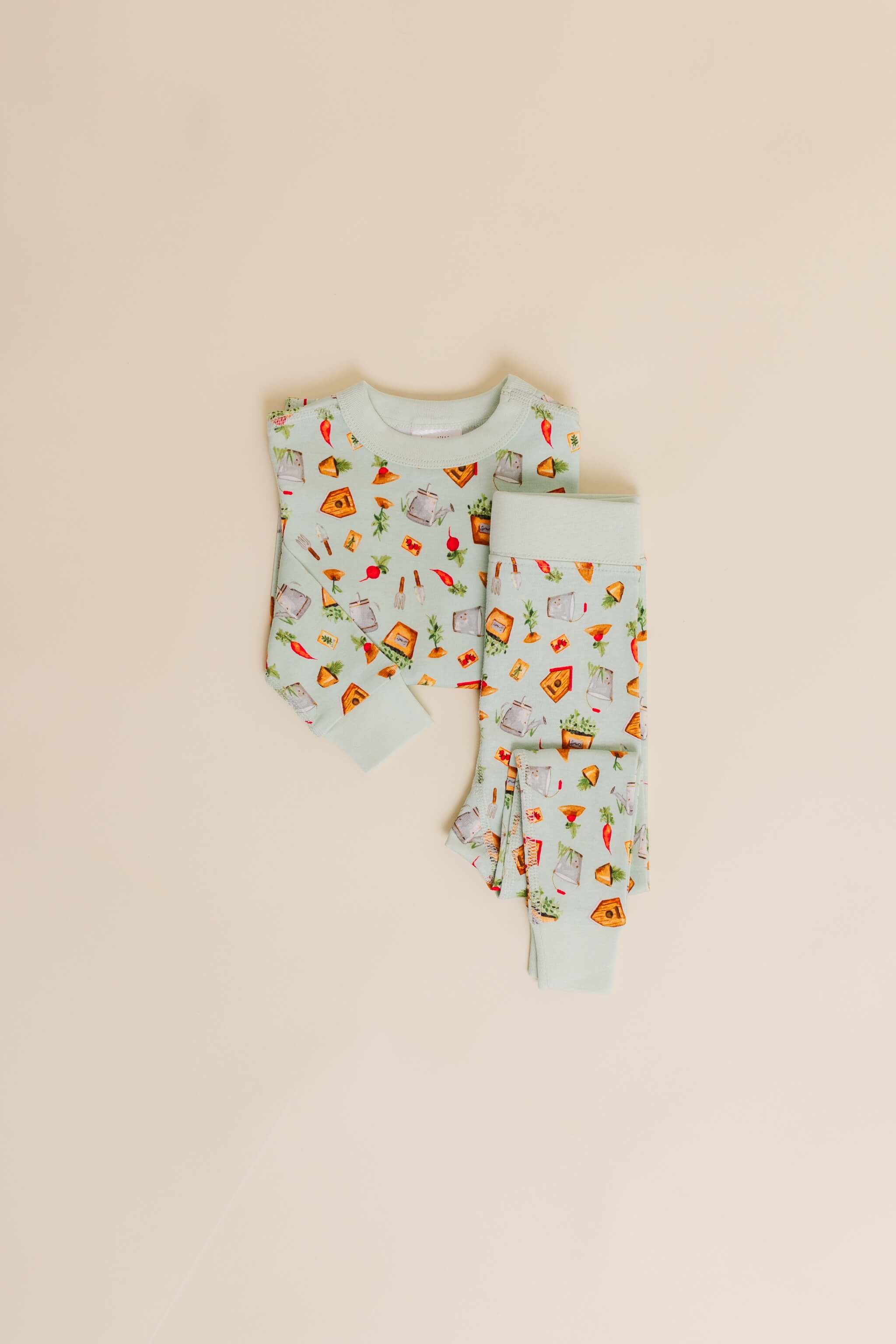 organic cotton children's long sleeve sleepwear in green garden print designed by cris rogerson