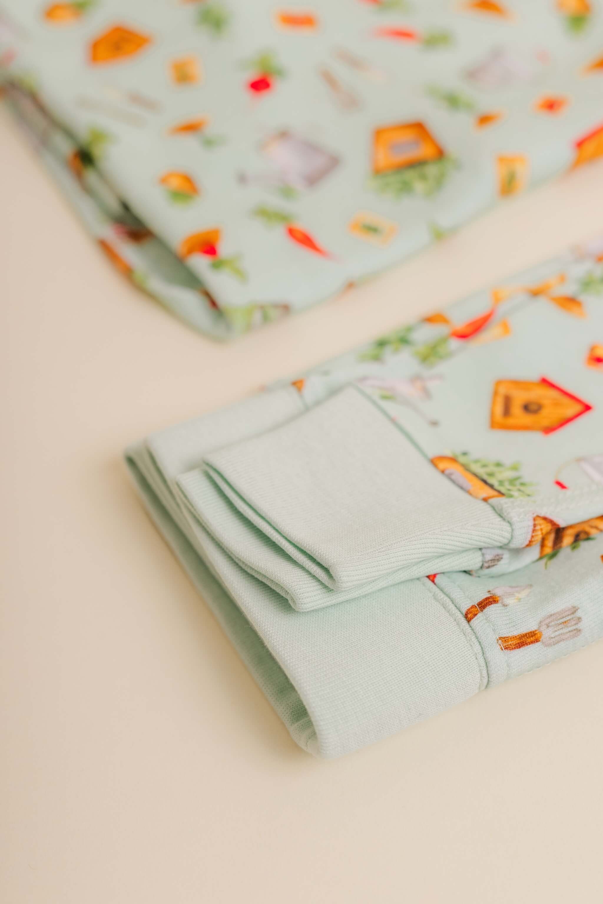 organic cotton children's long sleeve sleepwear in green garden print designed by cris rogerson